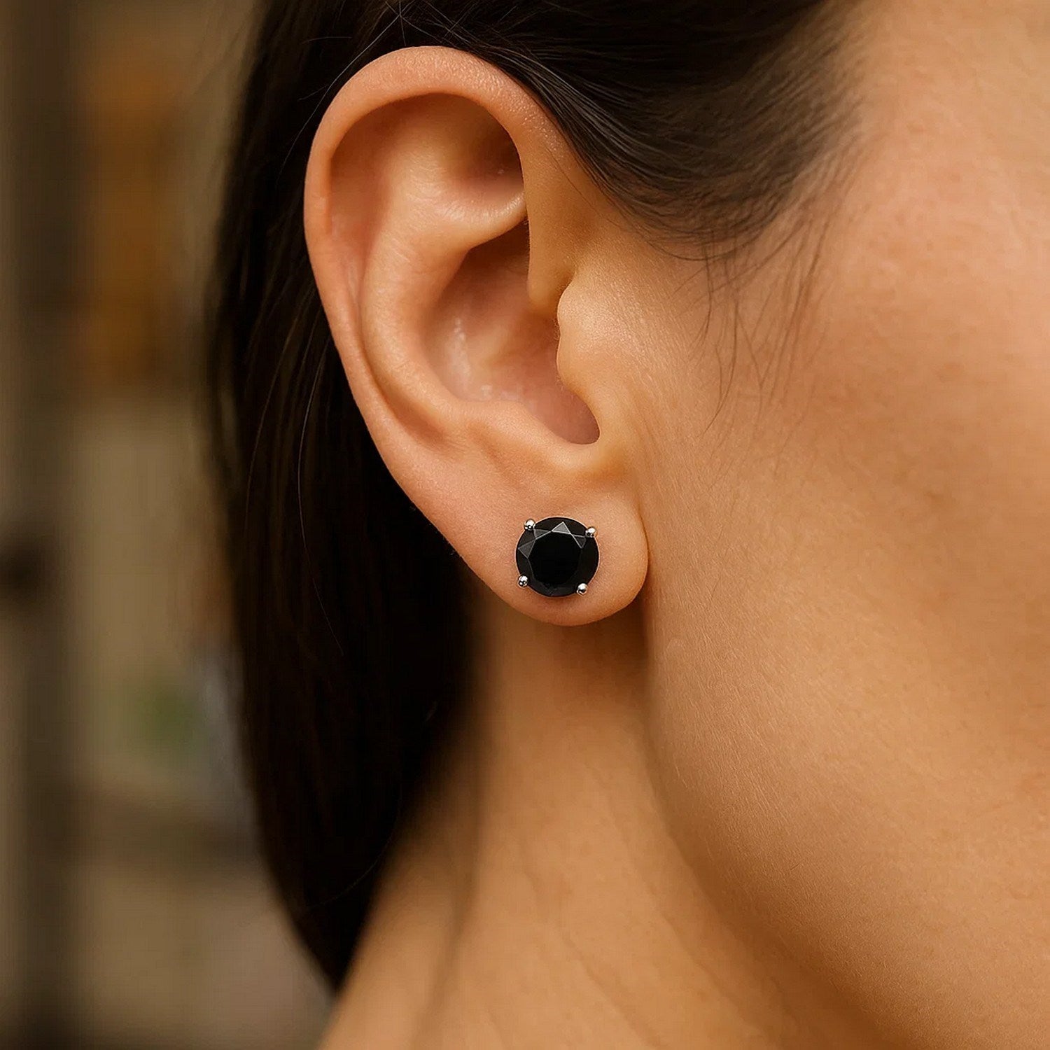 14k white gold contemporary stud earrings featuring faceted black cubic zirconia in elegant prong settings.