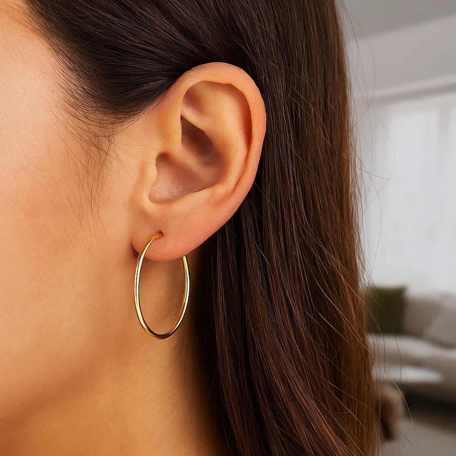 Elegant 14k yellow gold polished hoop earrings, 1.5x30mm, showcasing a timeless design for luxury jewelry lovers.