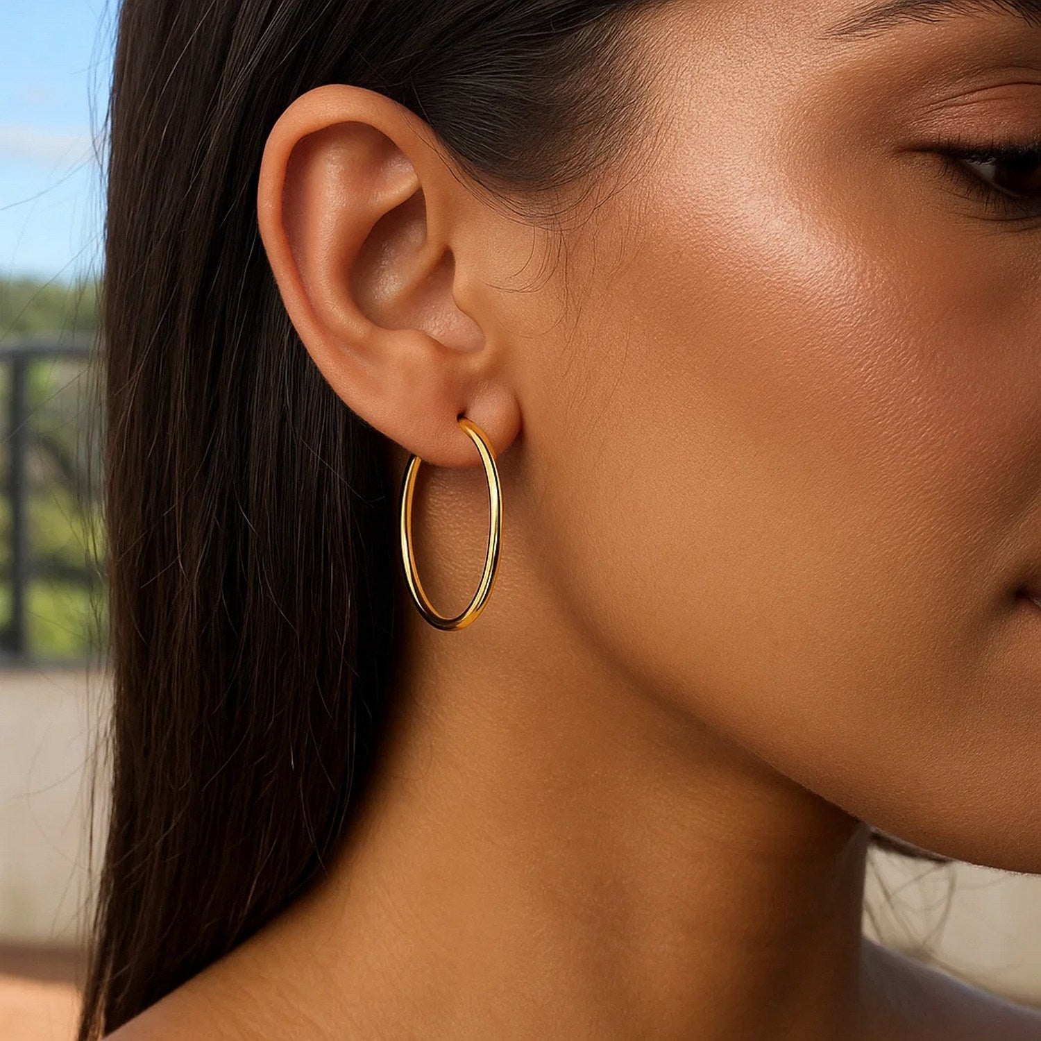 Elegant 14k yellow gold polished hoop earrings, measuring 1.5x30mm, showcasing a timeless design for luxury wear.