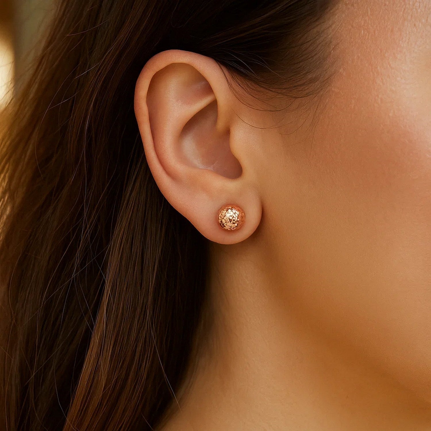 14k rose gold faceted ball stud earrings with a modern design, perfect for elegant everyday wear.
