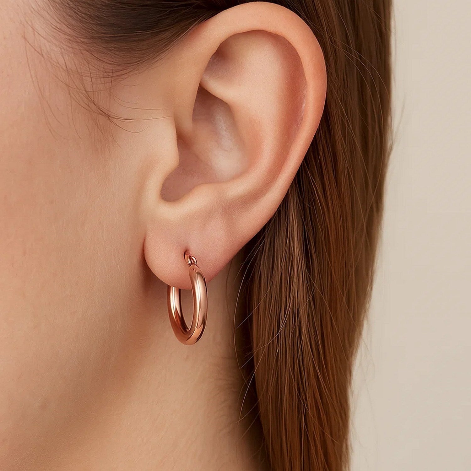 14k rose gold polished hoop earrings, minimalist design, elegant 3x15mm size, perfect for sophisticated styling.