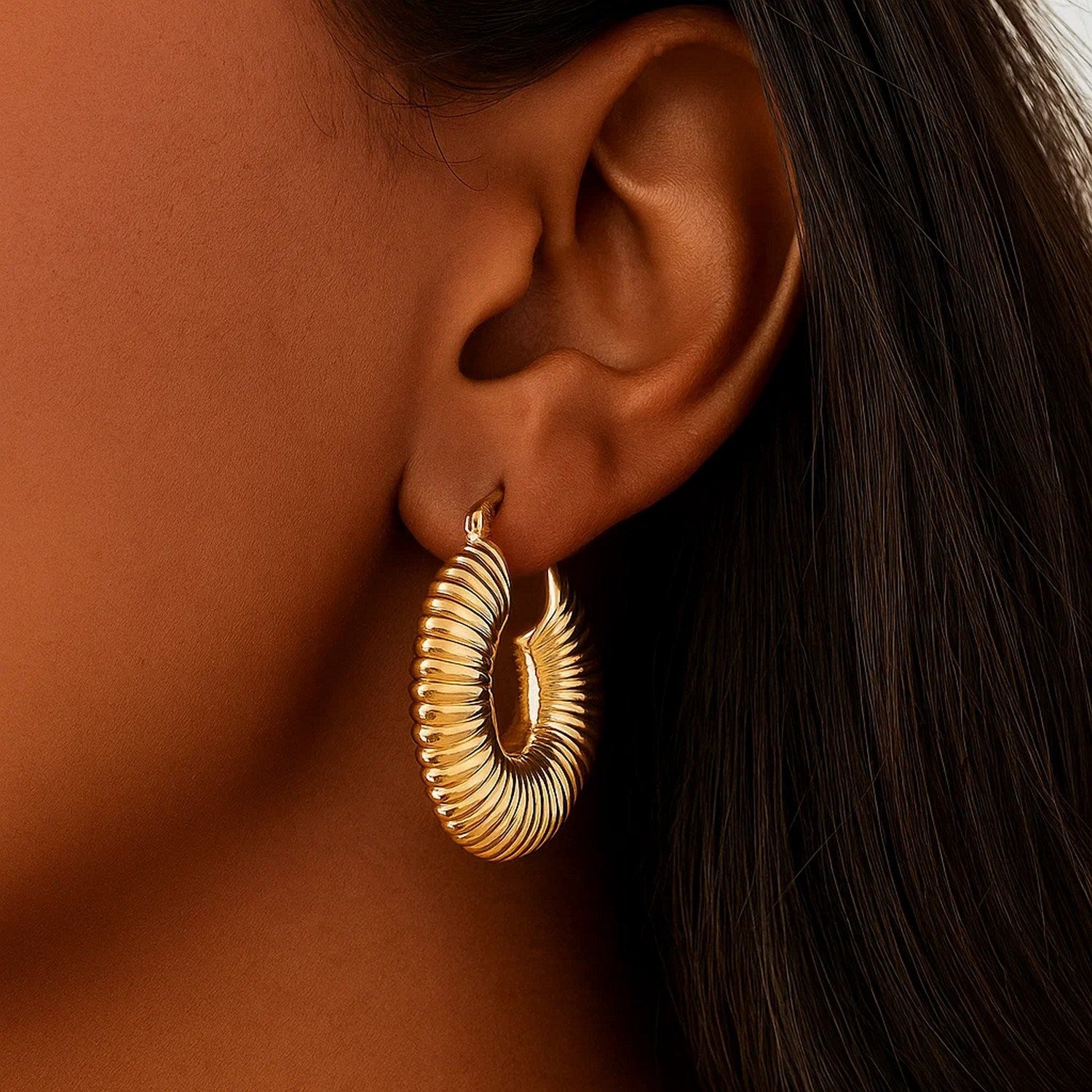 14k yellow gold ribbed hoop earrings showcasing a minimalist design, perfect for elegant everyday wear.