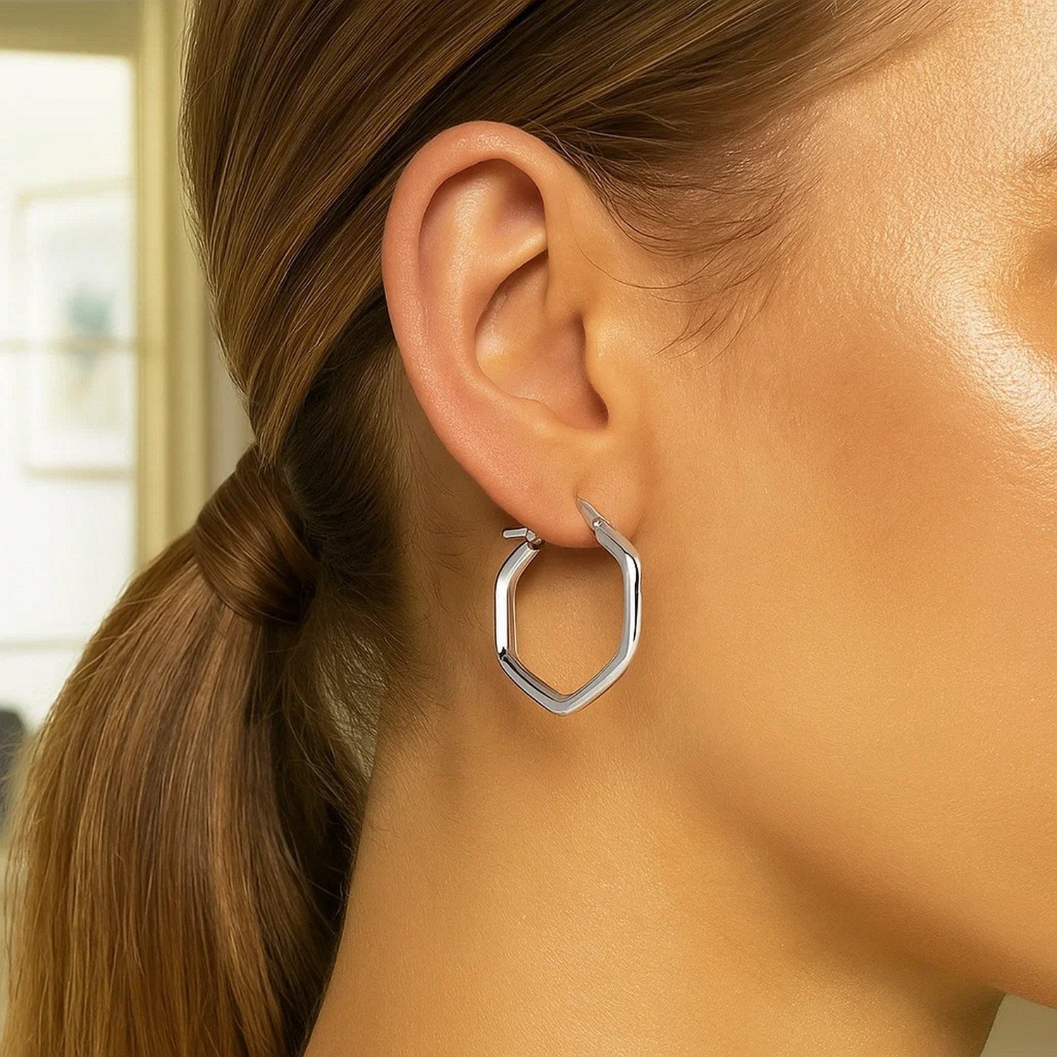 14k white gold shiny hexagon hoop earrings, showcasing a classic design with a contemporary twist for elegant style.