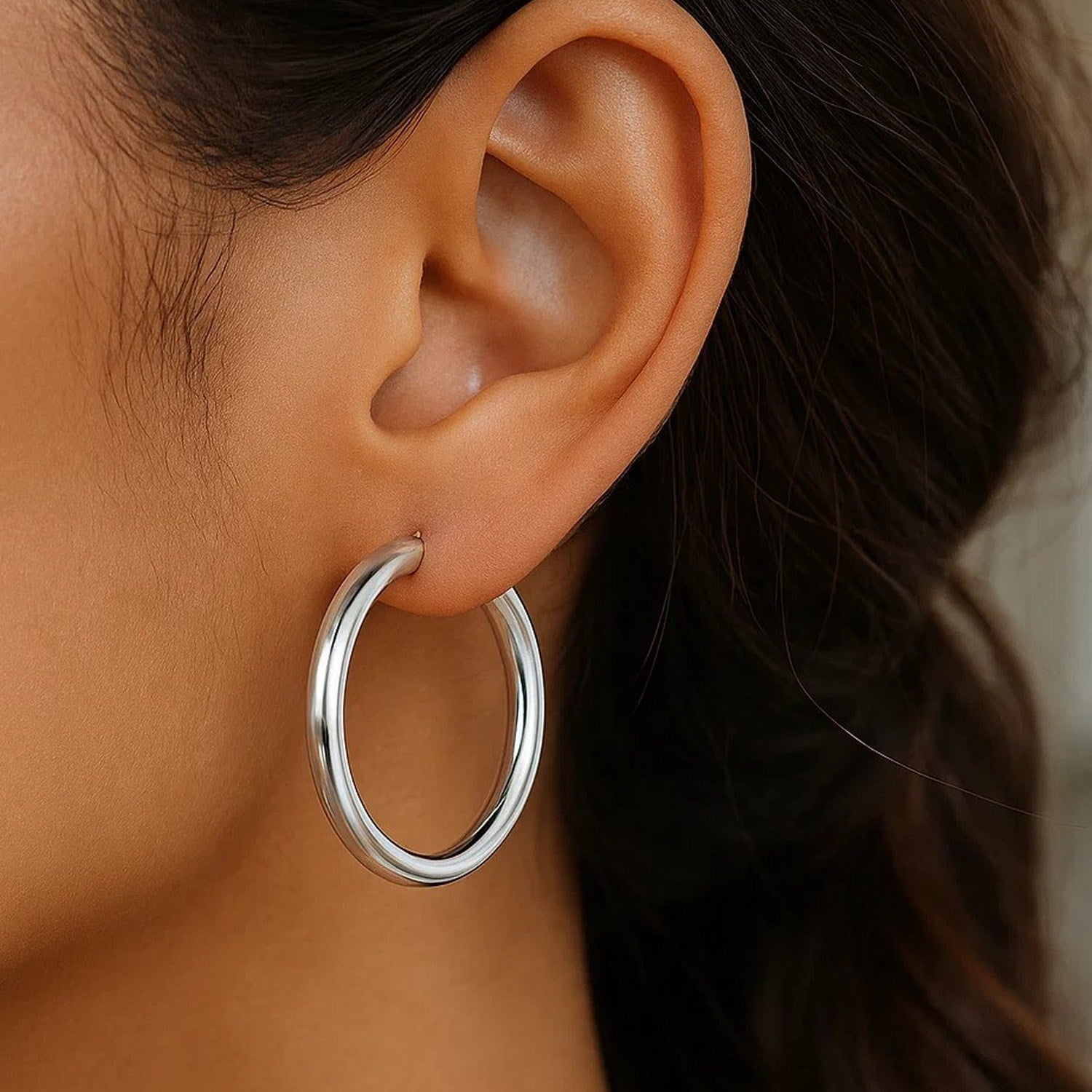 Sterling silver rhodium plated polished hoop earrings with a sleek modern design, perfect for elegant occasions.