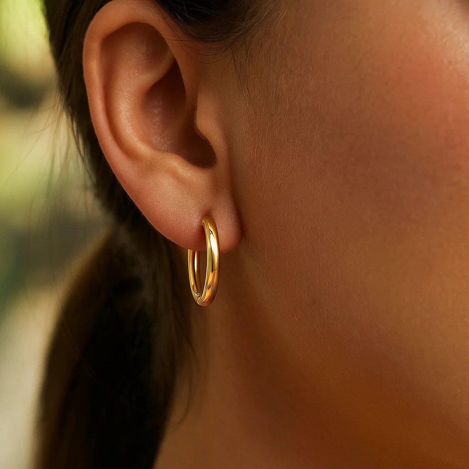 Elegant 14k yellow gold polished round hoop earrings, showcasing a timeless design for sophisticated style.