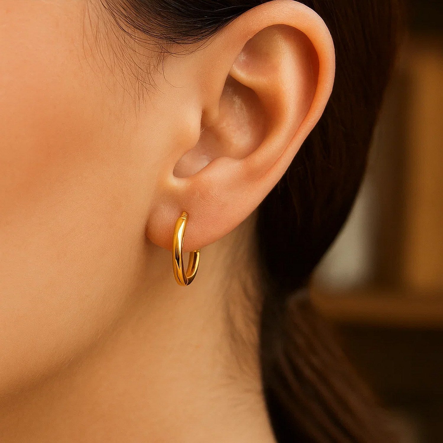 Elegant 14k yellow gold polished round hoop earrings with a refined stud design, perfect for any luxurious occasion.