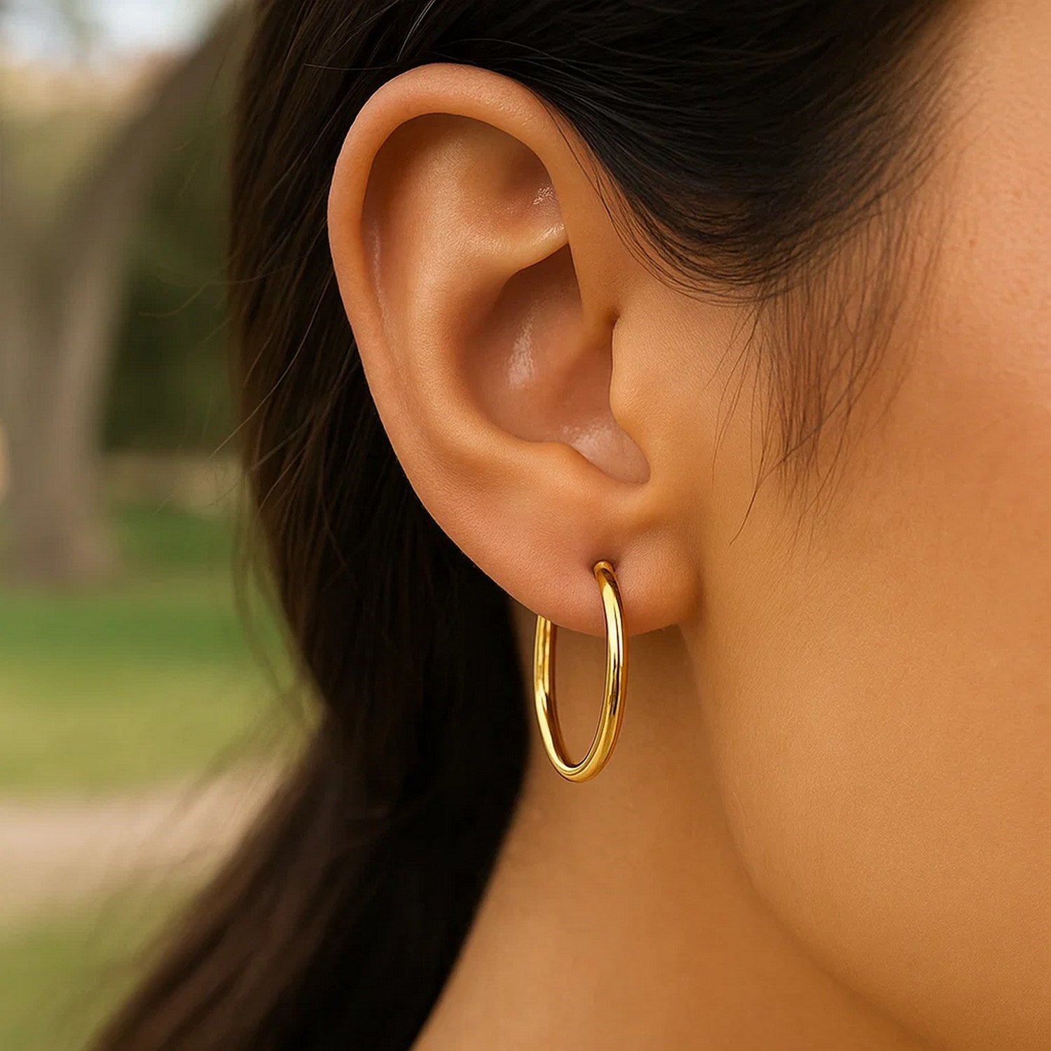 14k yellow gold minimalist endless round hoop earrings, showcasing timeless elegance and refined craftsmanship.
