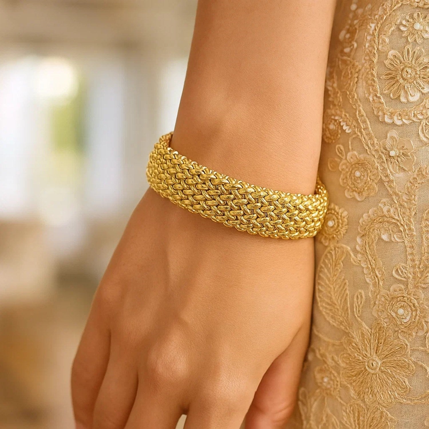 14k yellow gold high polish thick braided bracelet, modern luxury design, 14.50 mm width, perfect for elegant occasions.