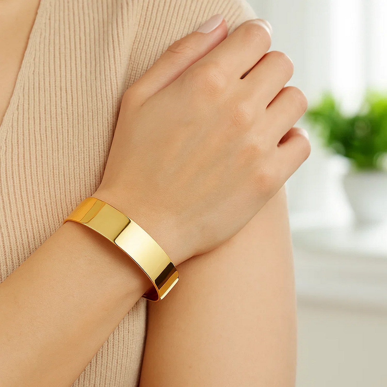 Designer medium width bracelet in 14k yellow gold, modern luxury style, showcasing exquisite craftsmanship and elegance.