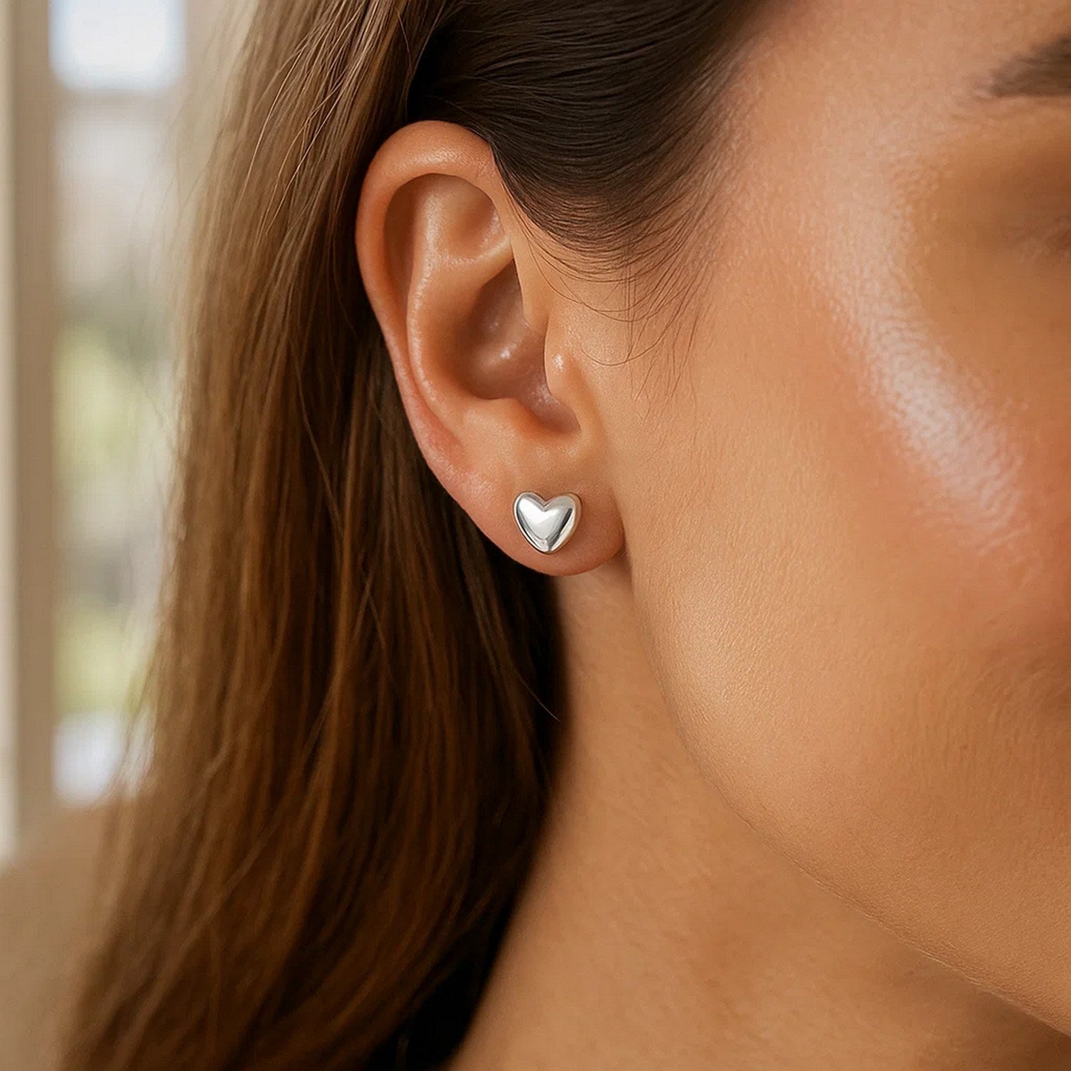 14k white gold polished puffed heart earrings with a minimalist design, perfect for elegant occasions.