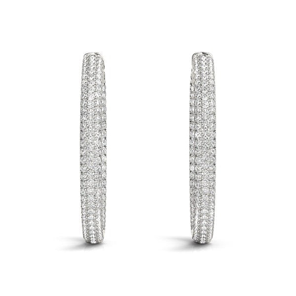 14k white gold pave set diamond hoop earrings featuring a modern design with 7 cttw of sparkling round diamonds.