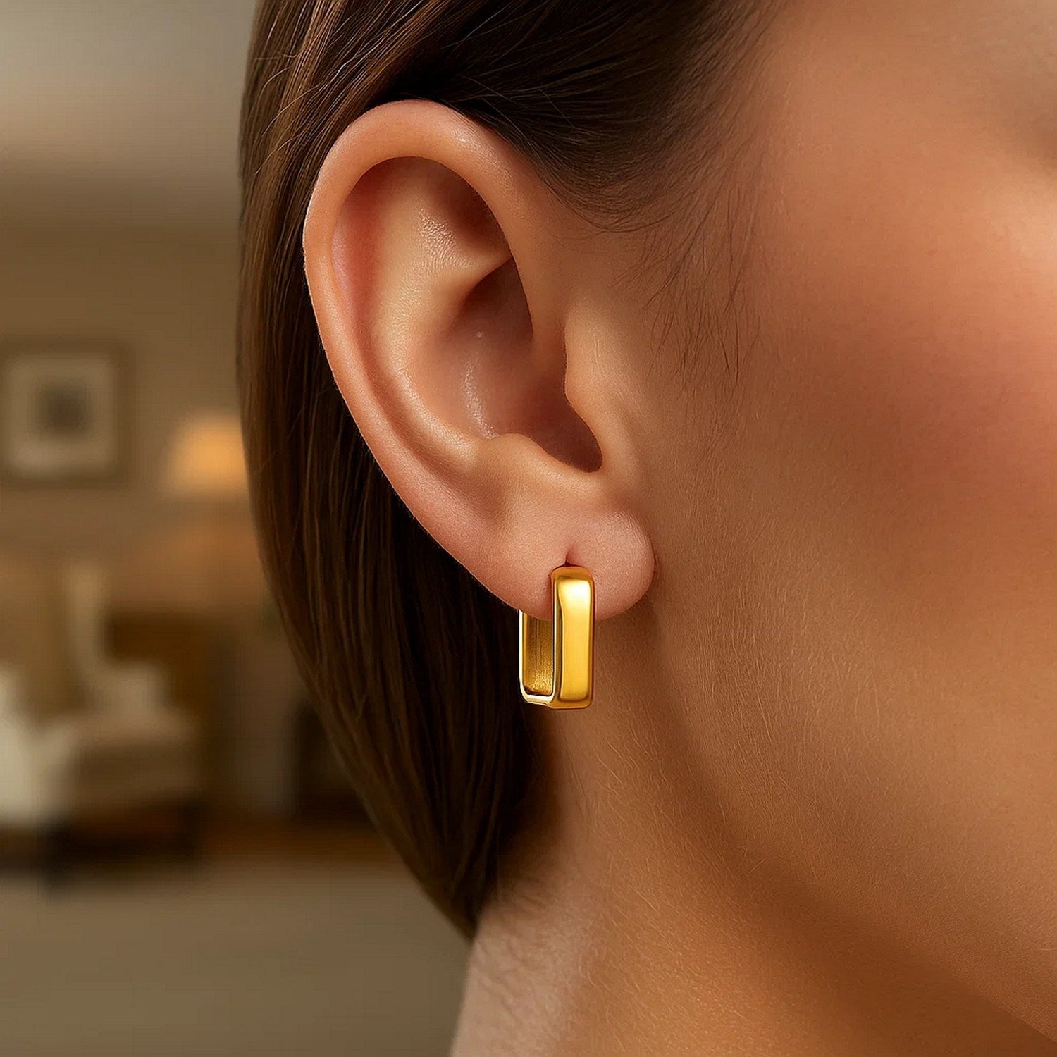 14k yellow gold polished hoop earrings with a sleek modern design, perfect for elegant everyday wear.