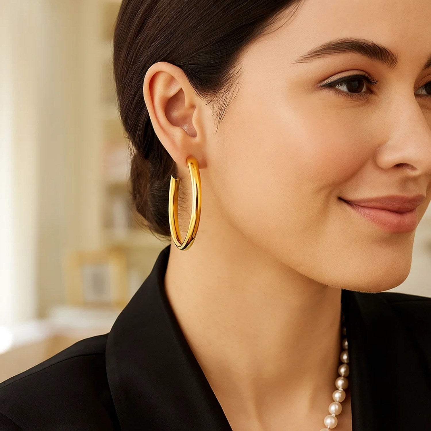 14k yellow gold polished hoop earrings with a modern design, showcasing elegance and timeless sophistication.
