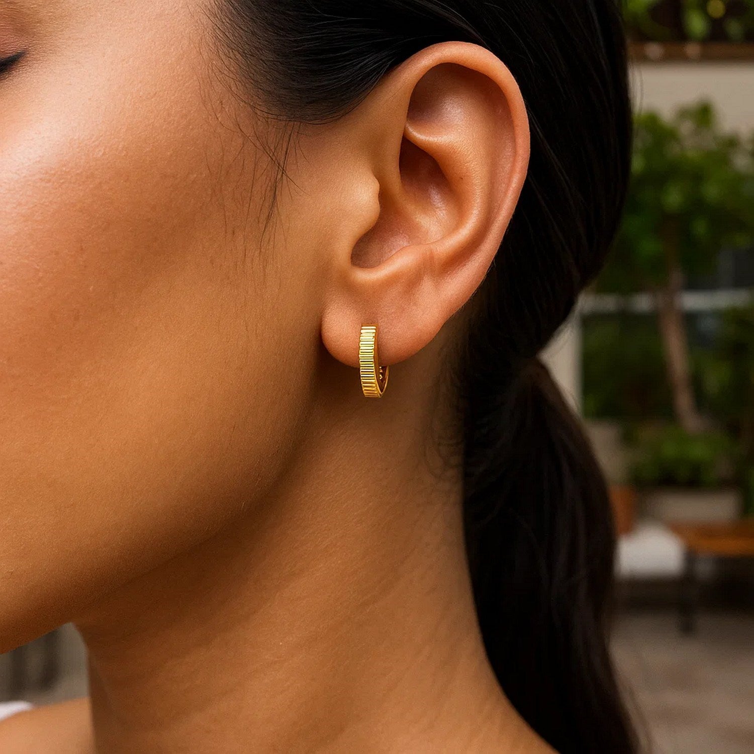 14k yellow gold textured petite round hoop earrings, showcasing modern elegance and refined craftsmanship.