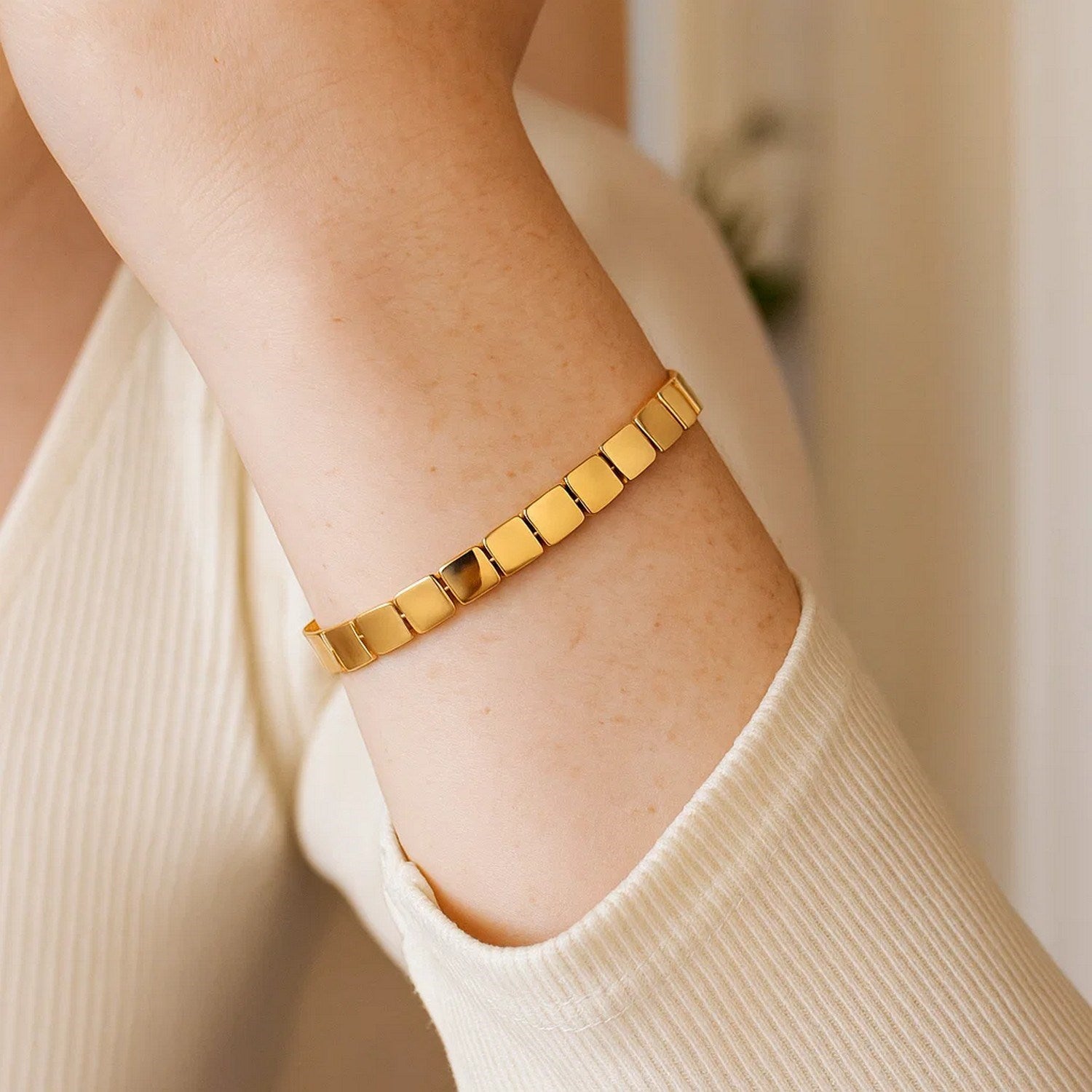 14k yellow gold high polish square link bracelet with modern design and elegant stud detailing, perfect for luxury styling.