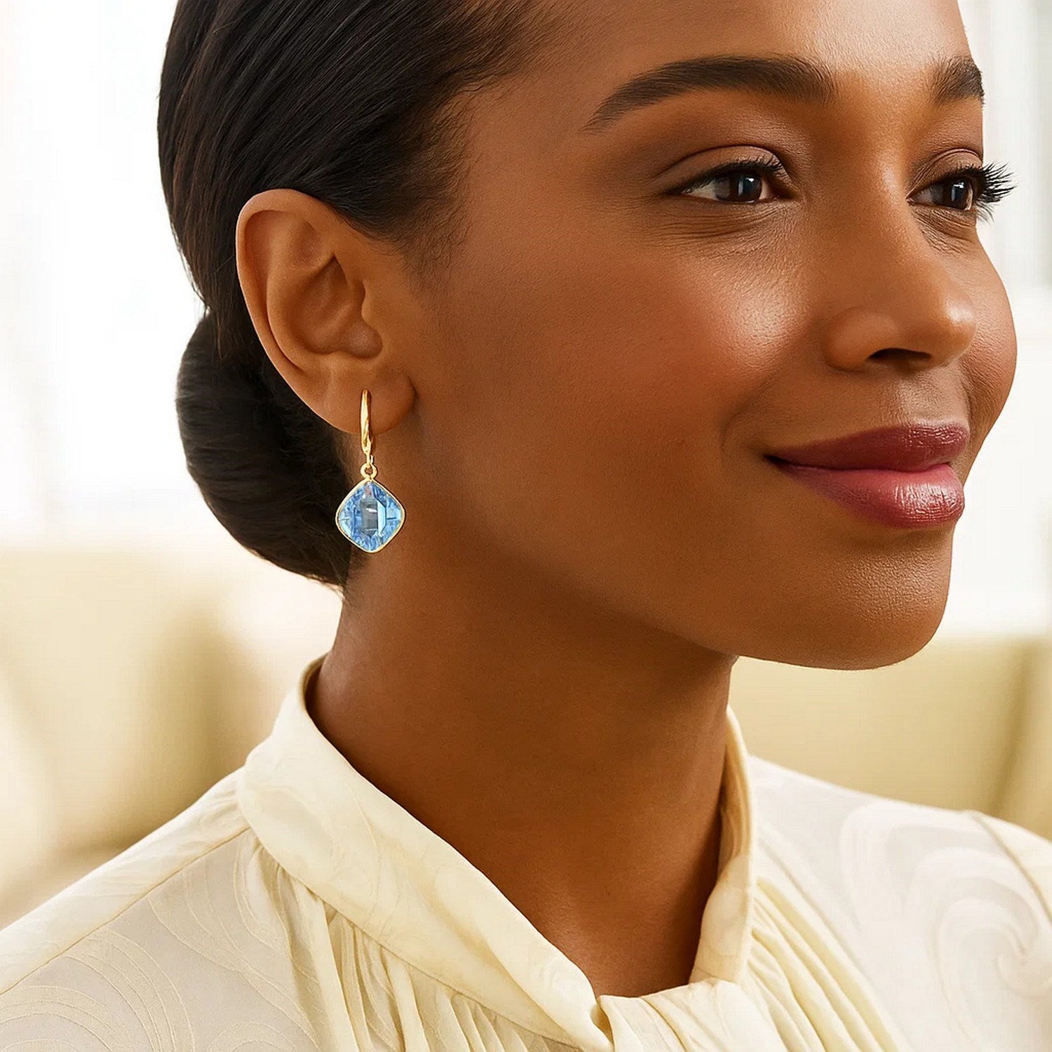14k yellow gold drop earrings featuring blue topaz cushion briolettes in elegant bezel settings for a modern look.