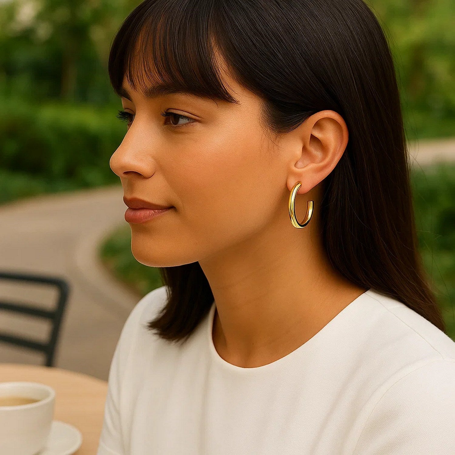 14k yellow gold modern round C hoop earrings showcasing elegant craftsmanship and timeless style.