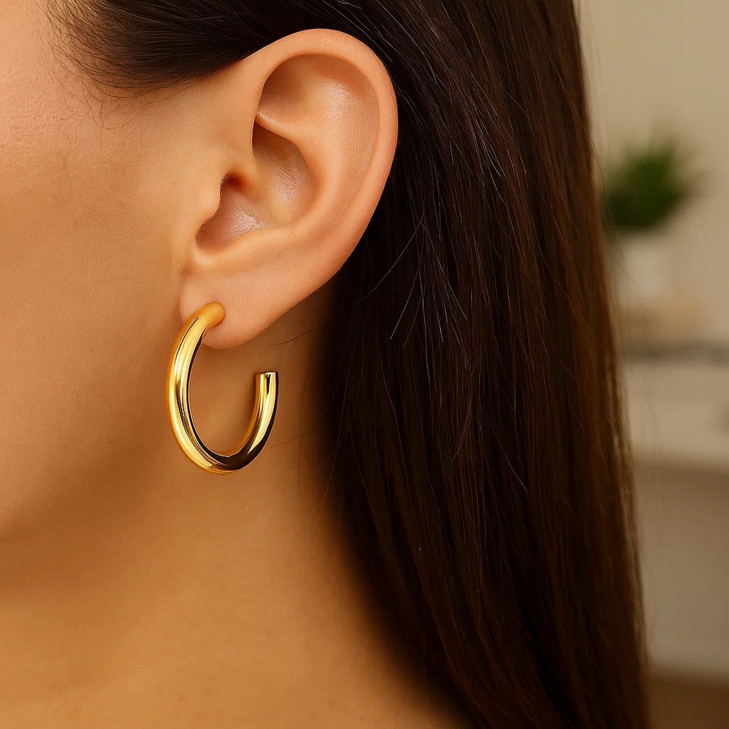 14k yellow gold modern round C hoop earrings showcasing a sleek, elegant design for a luxurious touch.