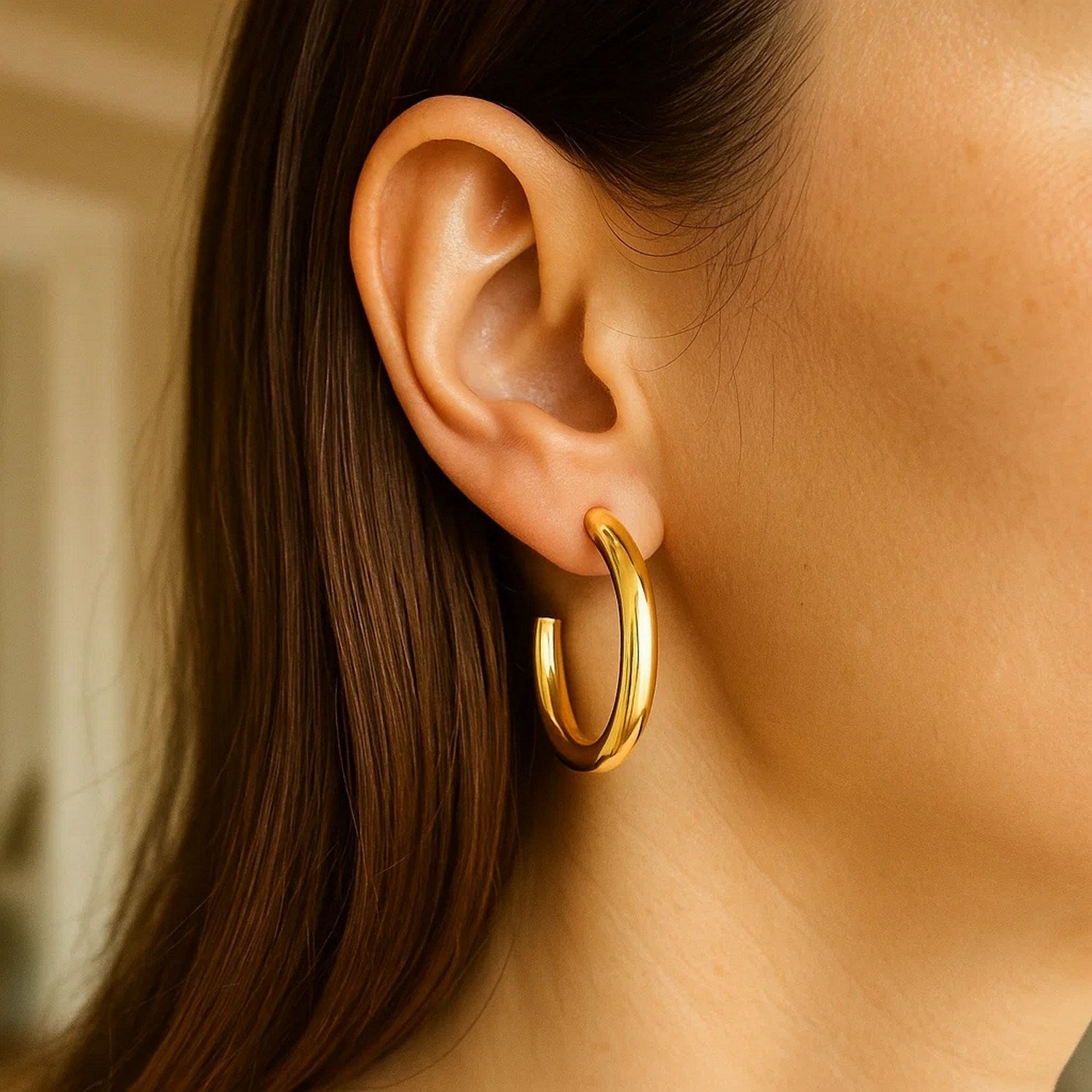 14k yellow gold modern round C hoop earrings showcasing a sleek, elegant design for sophisticated style.