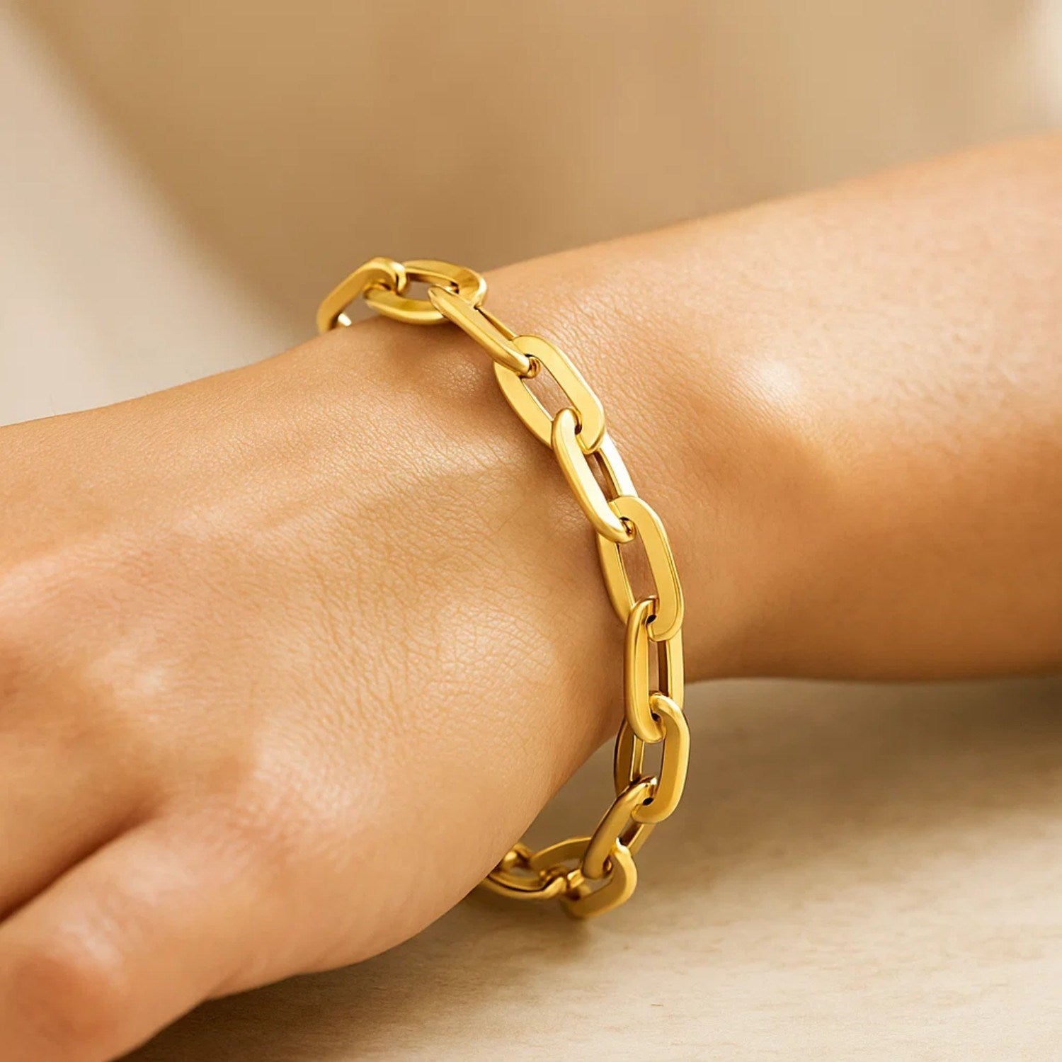 14K yellow gold long mirror rolo link chain bracelet, modern design with elegant shine and luxurious appeal.