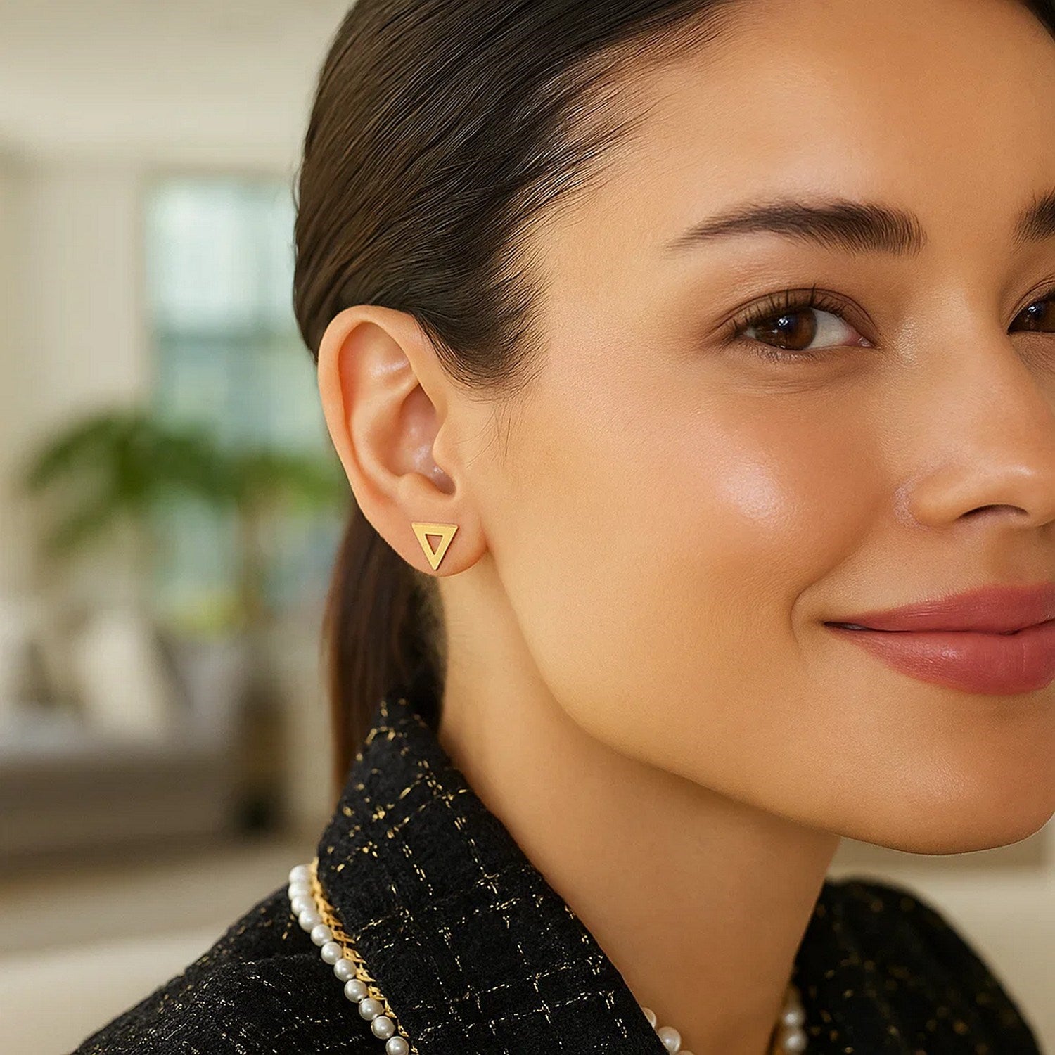 14k yellow gold polished open triangle stud earrings, showcasing a modern design for elegant sophistication.