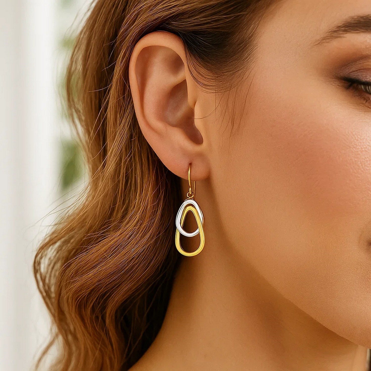 14k two-tone gold polished drop teardrop earrings showcasing modern elegance and refined craftsmanship.