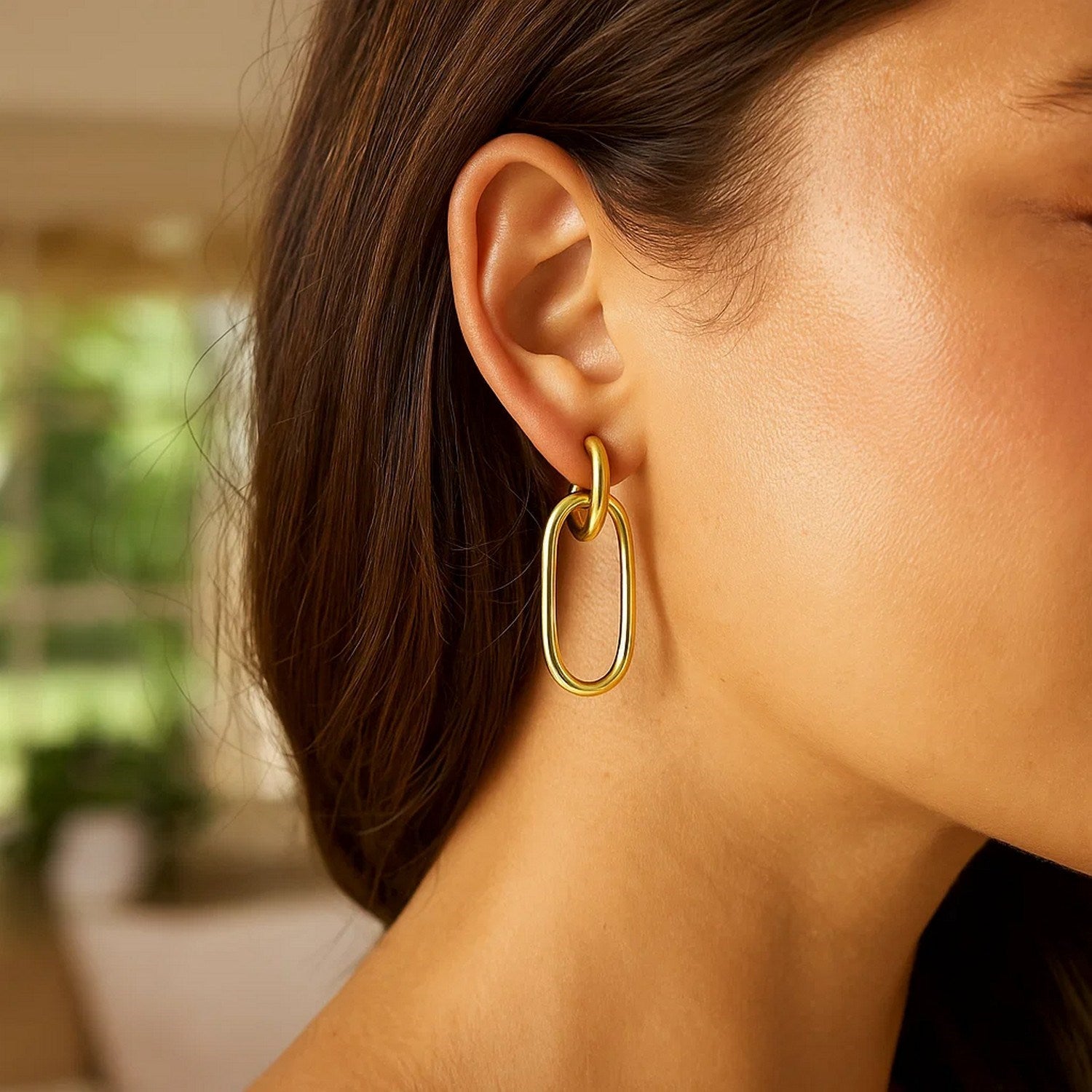 14k yellow gold polished oval linked hoop earrings with a modern design, perfect for elegant occasions.