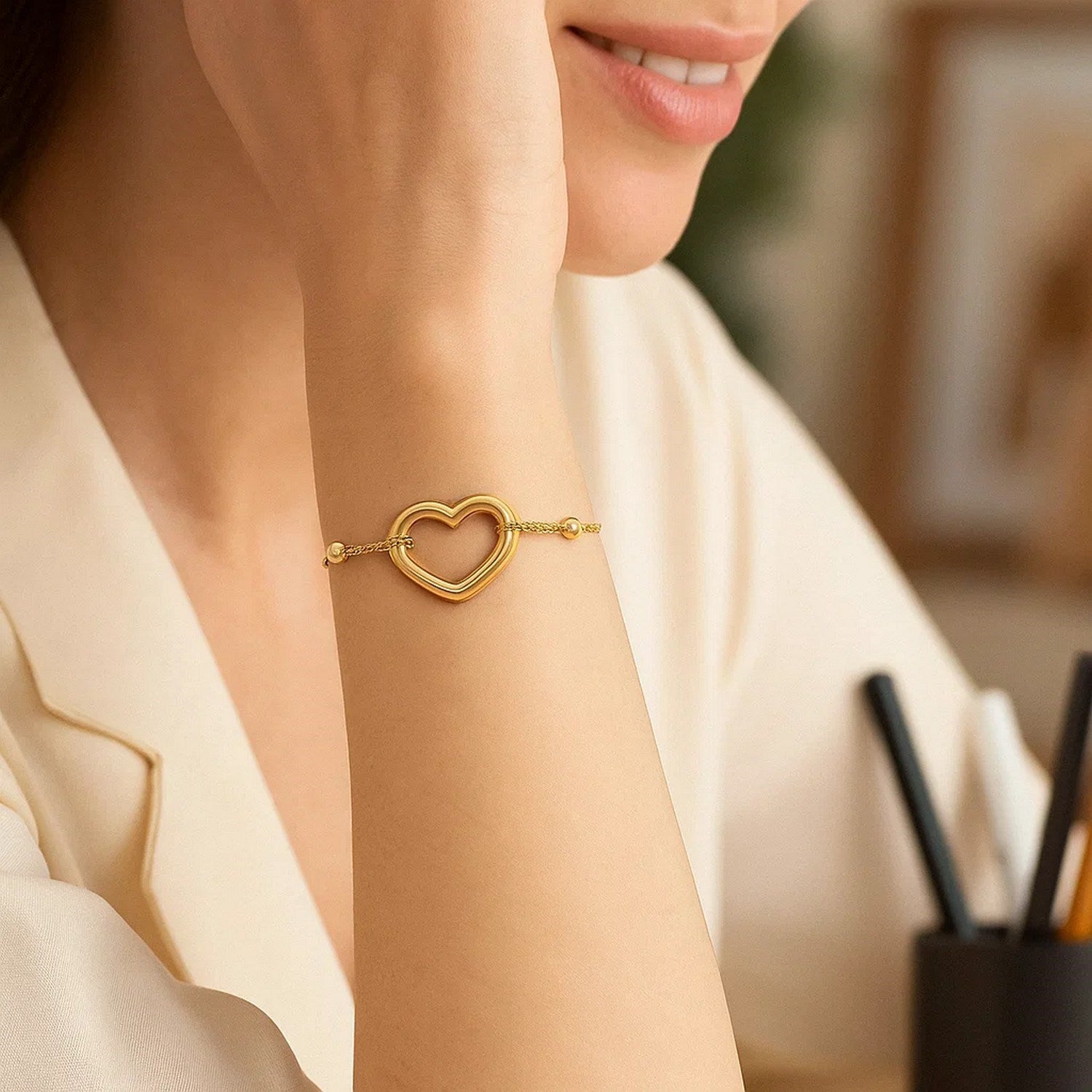 Adjustable 14k yellow gold bracelet featuring a modern shiny open heart design, perfect for luxury jewelry lovers.