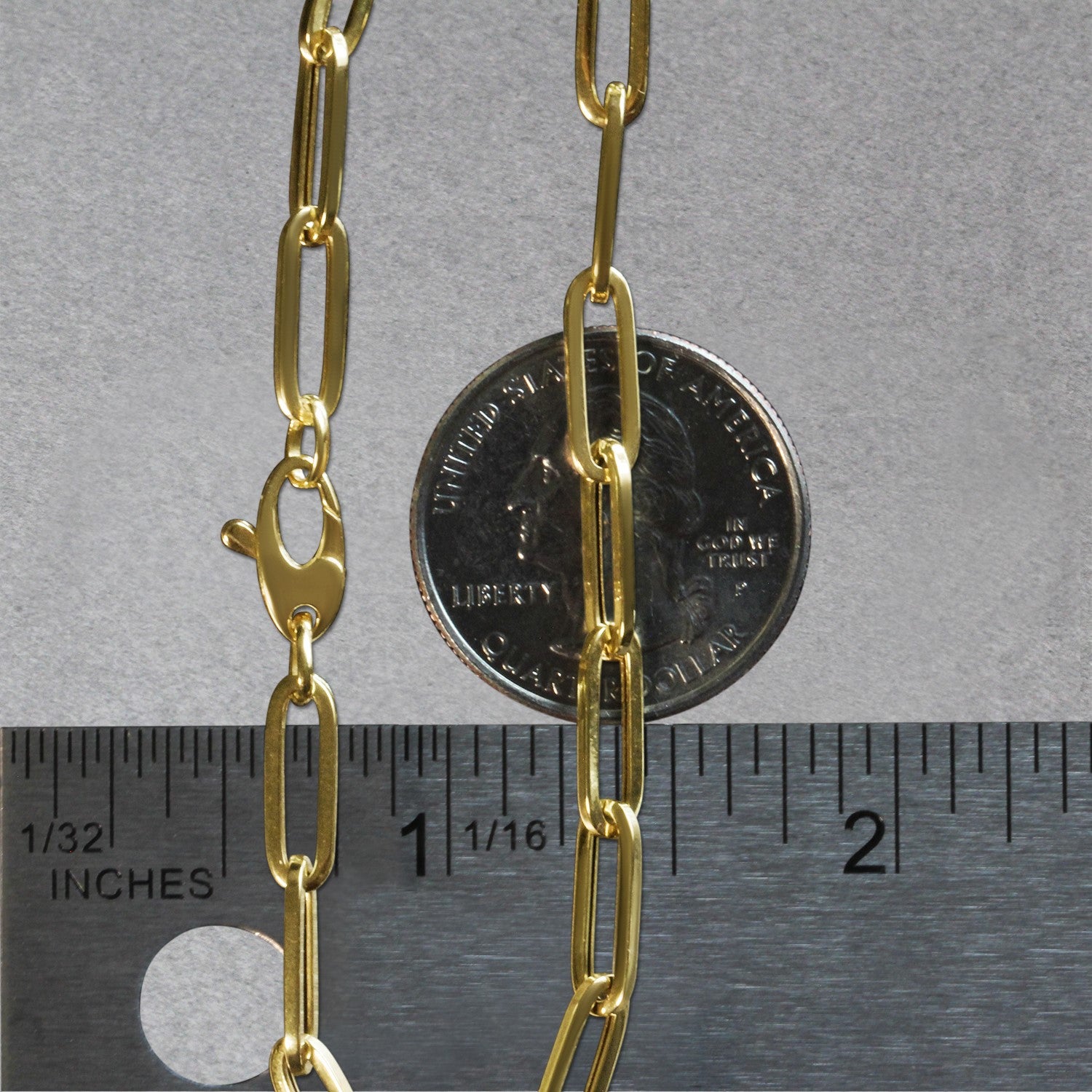 14K yellow gold bold paperclip chain bracelet with modern design and elegant round links, perfect for luxury styling.