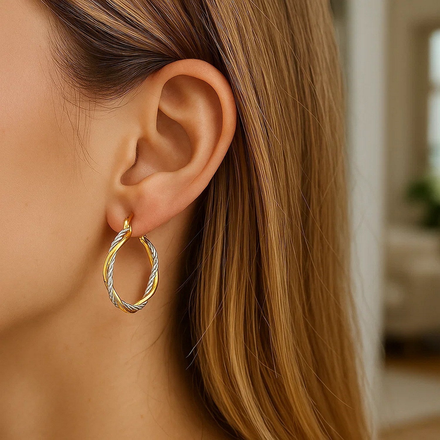 14k yellow and white gold textured twisted hoop earrings, showcasing elegant craftsmanship and luxurious design.