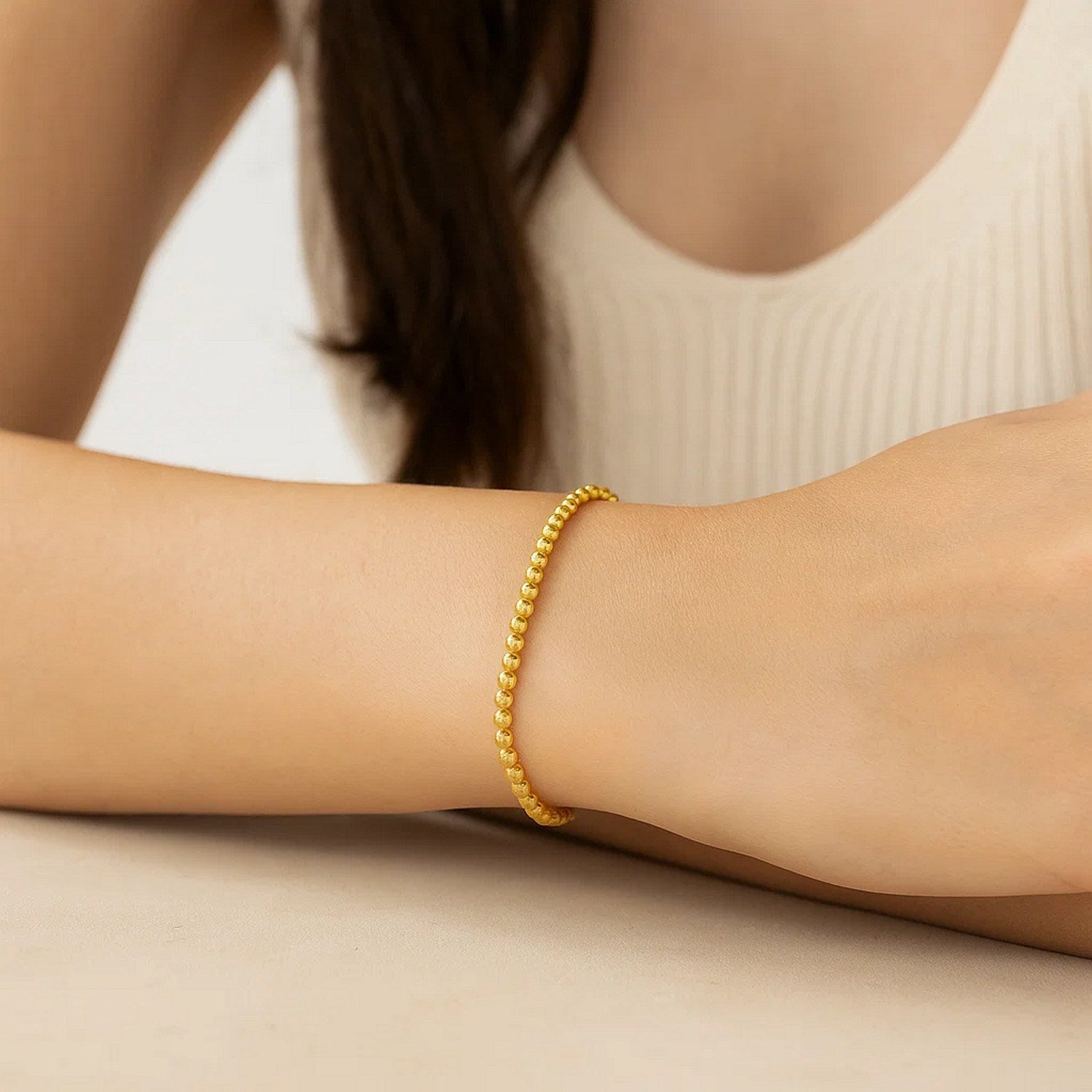 14k yellow gold bead bracelet with modern design, featuring 4.00 mm beads for a luxurious touch.