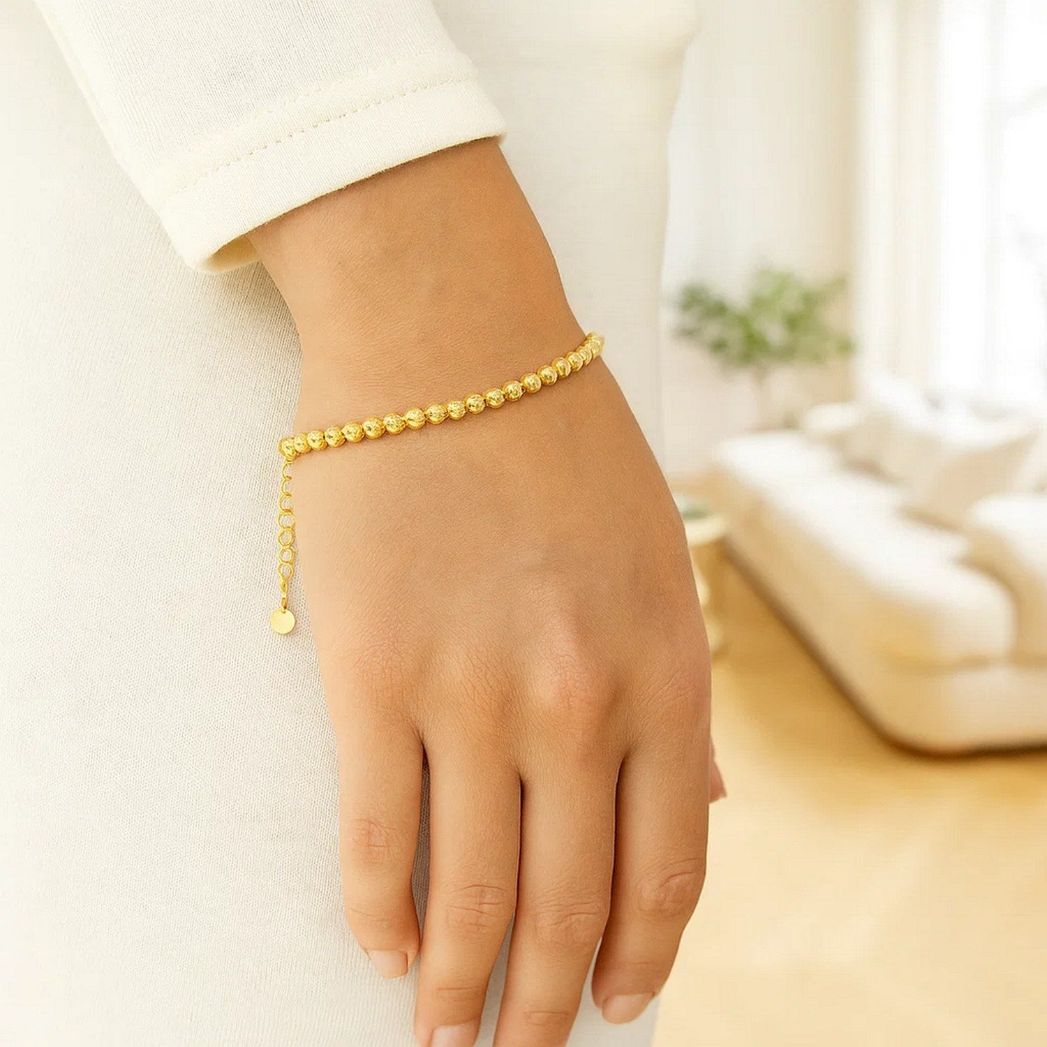 14k yellow gold bead bracelet with modern design, featuring 4.00 mm beads for a luxurious touch.
