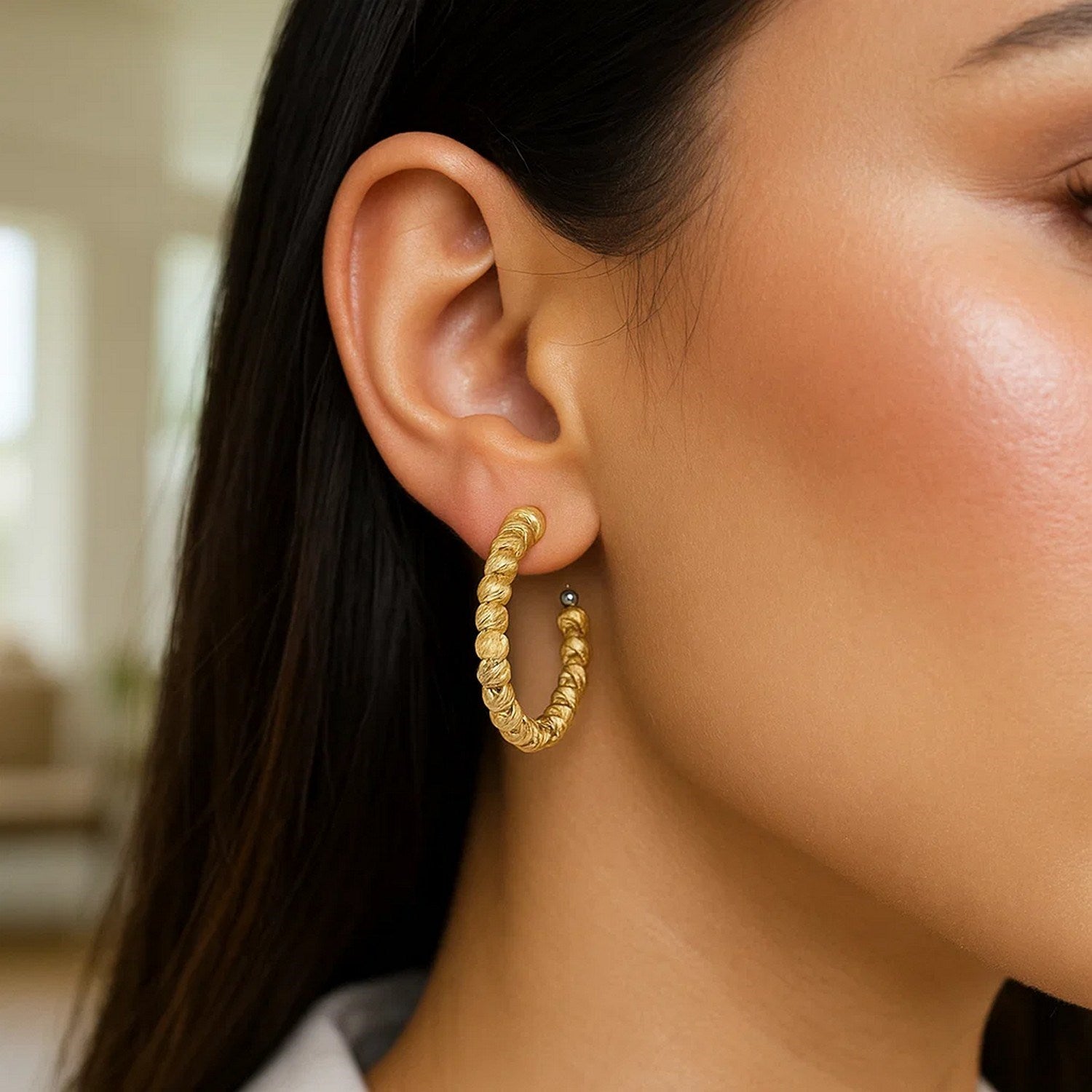 14k yellow gold polished hoop earrings with a sleek, modern design, perfect for elegant everyday wear.