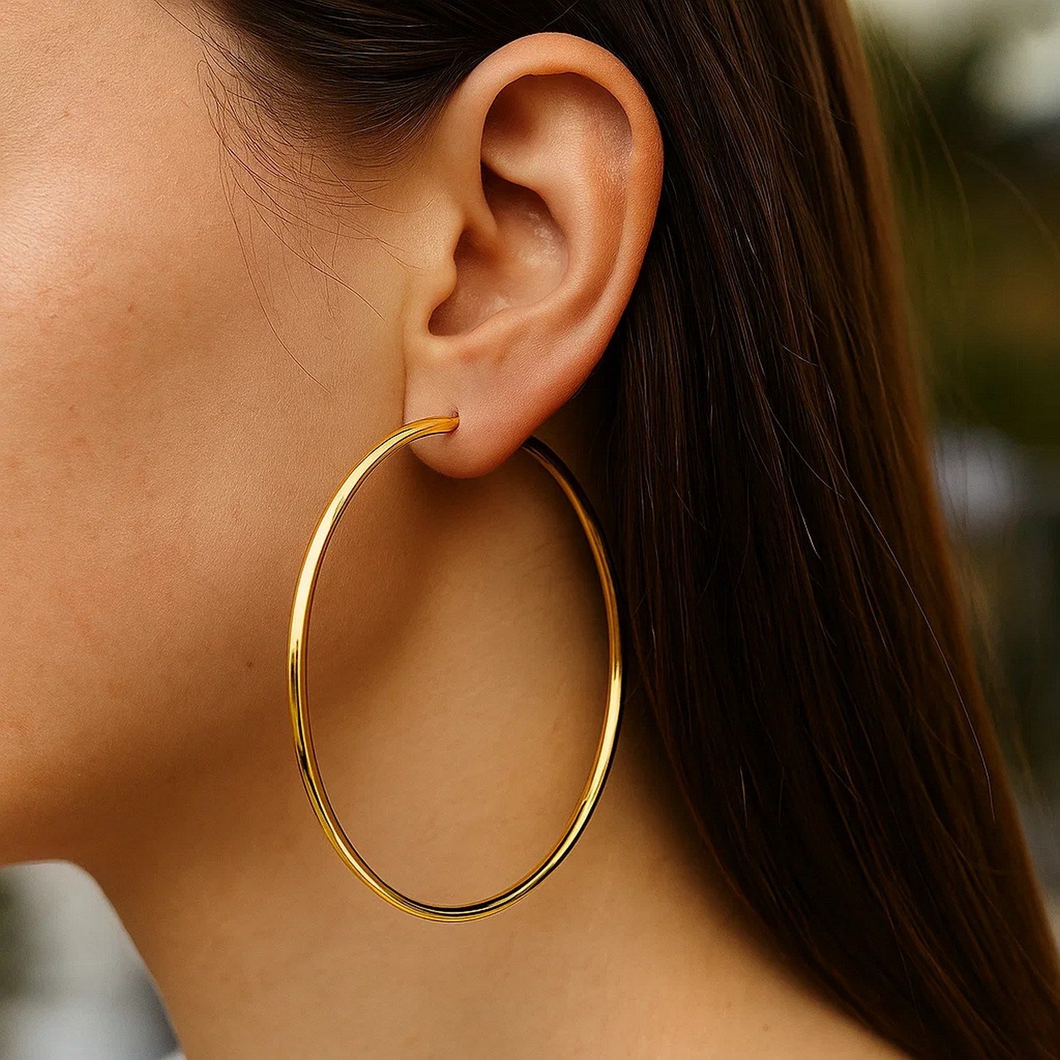 14k yellow gold polished hoop earrings with a sleek minimalist design, perfect for elegant everyday wear.