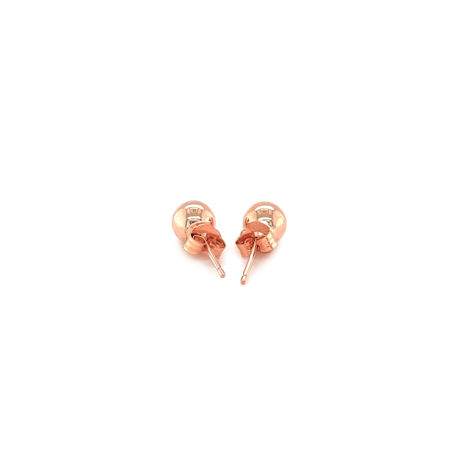 14k rose gold round stud earrings (5mm) with a modern design, perfect for elegant everyday wear.