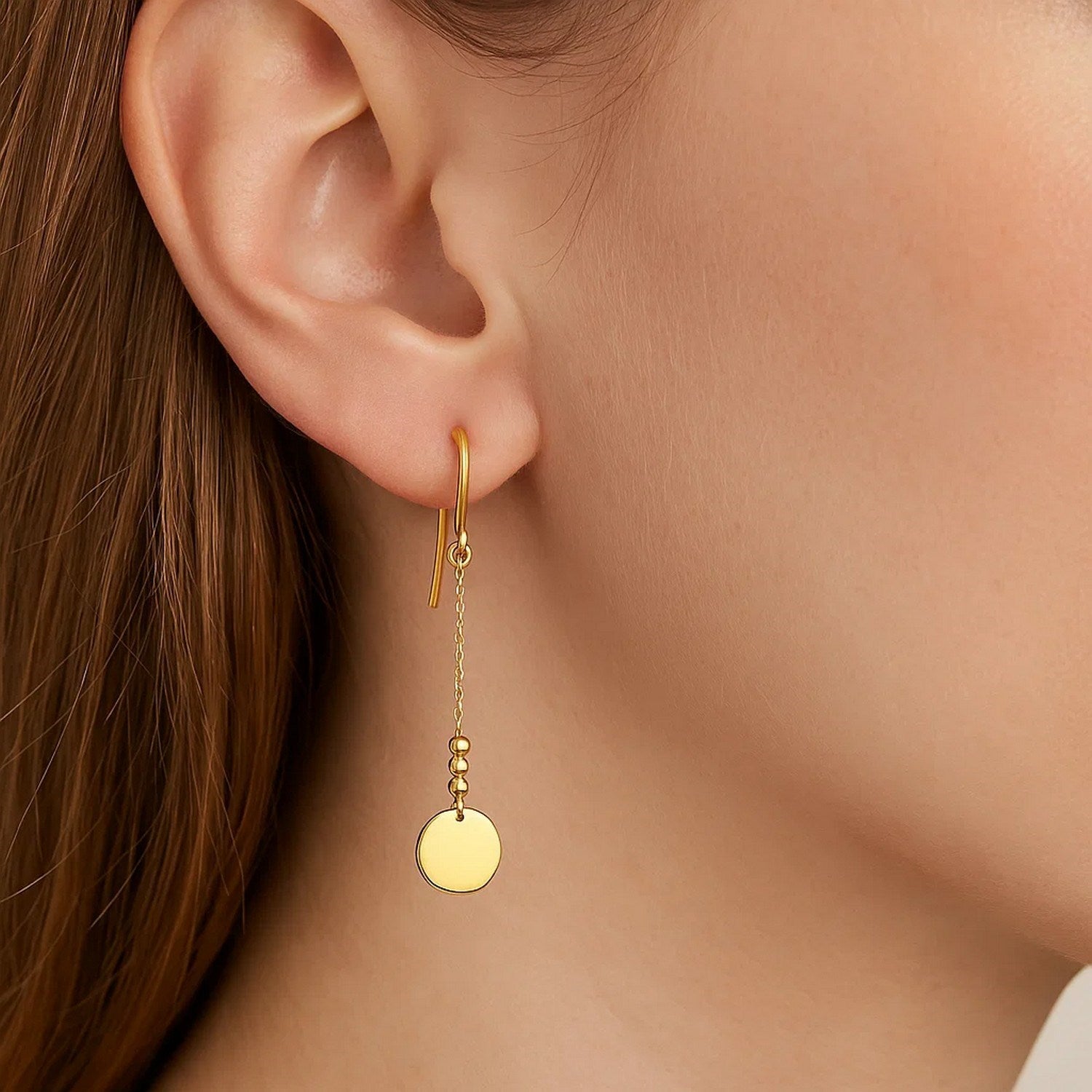 14k yellow gold polished drop earrings featuring shimmering diamonds on elegant chains, embodying modern luxury.