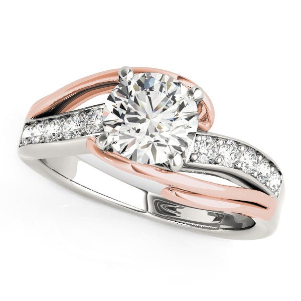 14k white and rose gold bypass shank engagement ring featuring a round diamond in a contemporary prong setting.