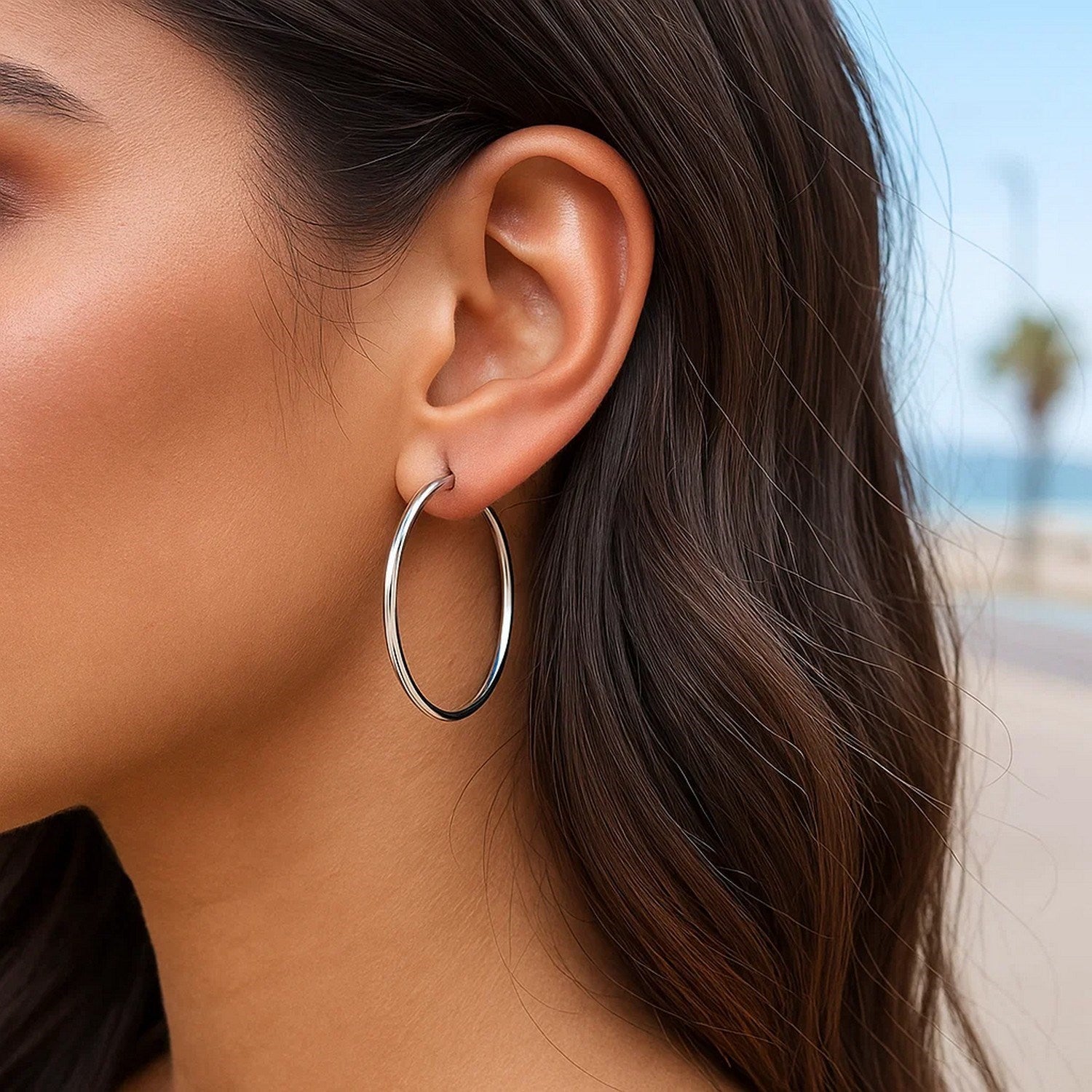 Sterling silver polished hoop earrings, classic design, 35mm diameter, perfect for elegant everyday wear.