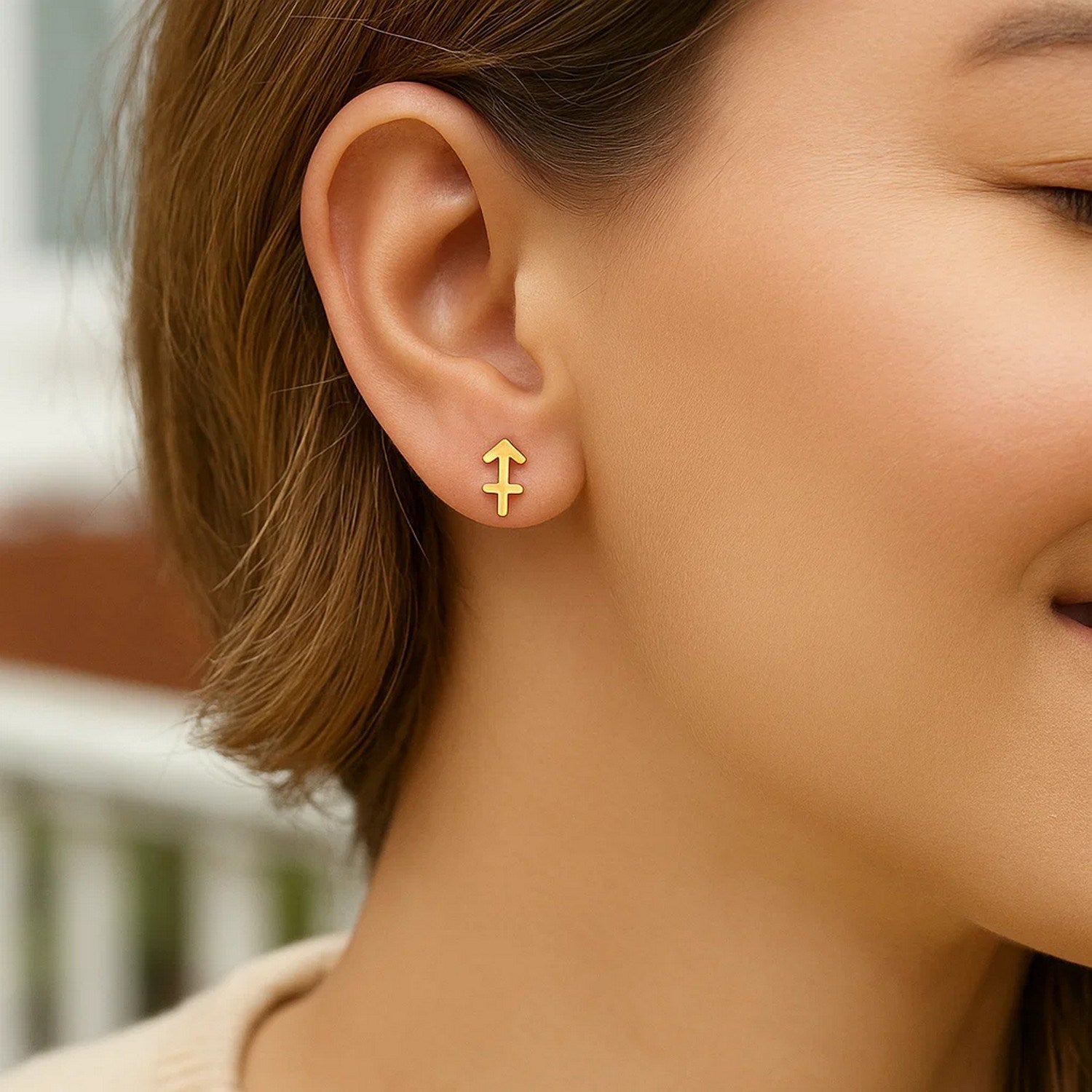 Elegant 14k yellow gold Sagittarius stud earrings showcasing a refined design perfect for any luxury occasion.