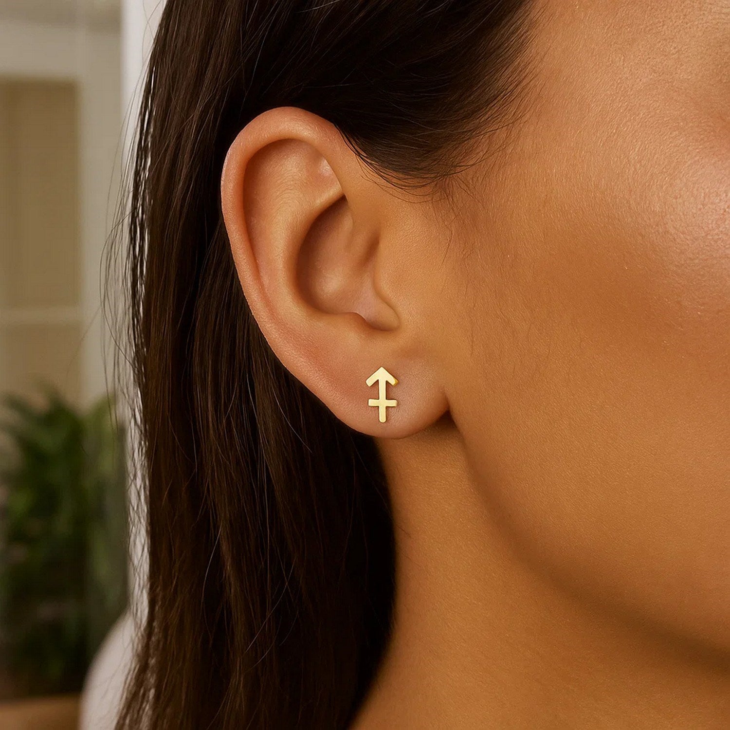 Elegant 14k yellow gold Sagittarius stud earrings featuring a refined design, perfect for sophisticated occasions.