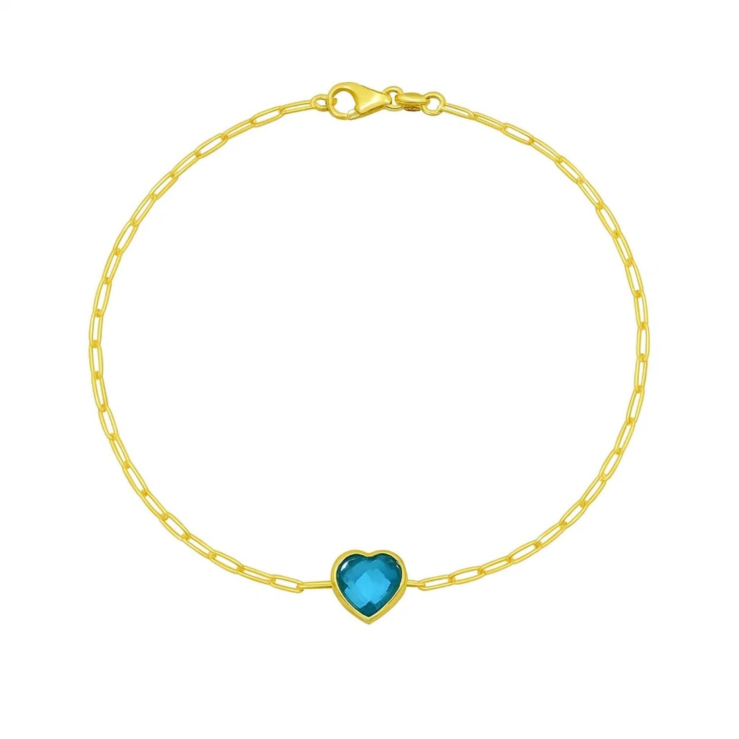 14k yellow gold bracelet featuring a heart-shaped blue topaz in a modern bezel setting, perfect for elegant occasions.