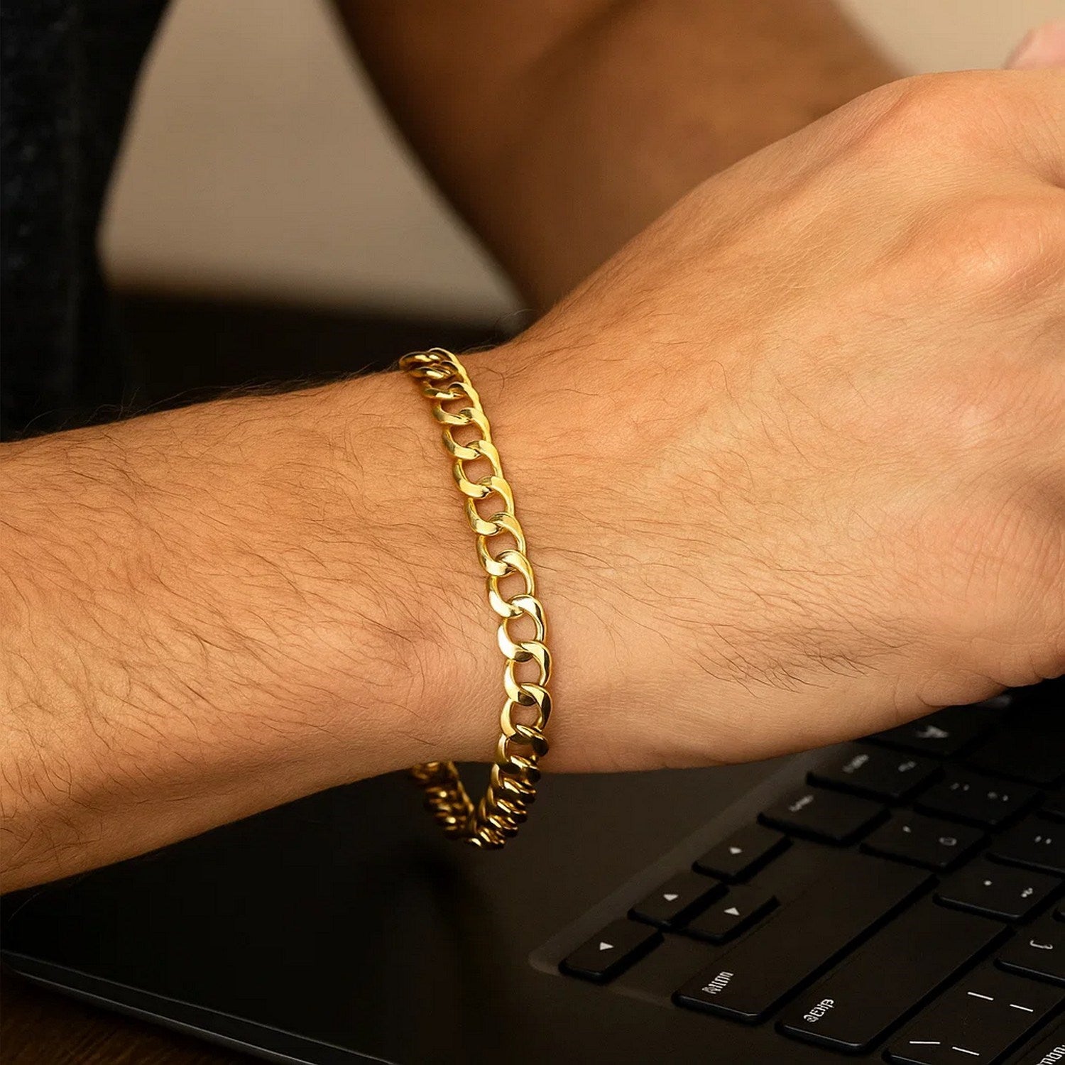 Minimalist 10k yellow gold curb bracelet featuring a sleek chain design, perfect for elegant everyday wear.