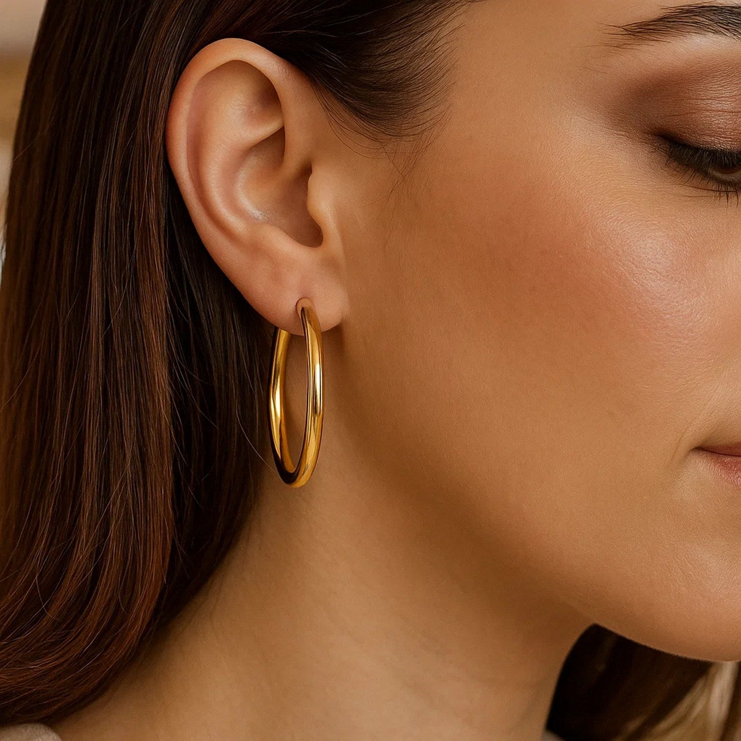 14k yellow gold polished medium wedding hoop earrings with a sleek modern design, perfect for elegant occasions.
