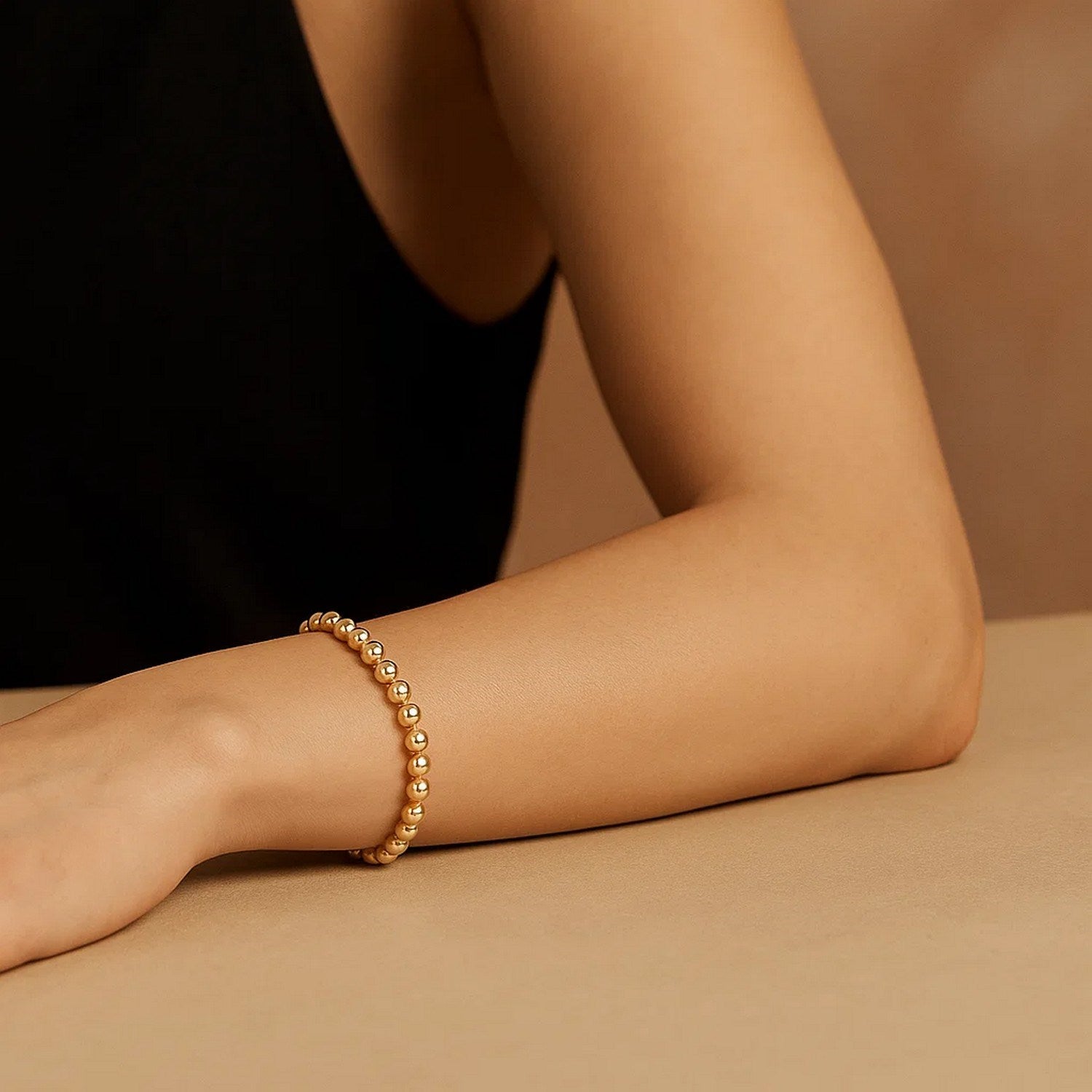 14k yellow gold bead bracelet with modern design, featuring elegant 4.00 mm beads for a luxurious touch.