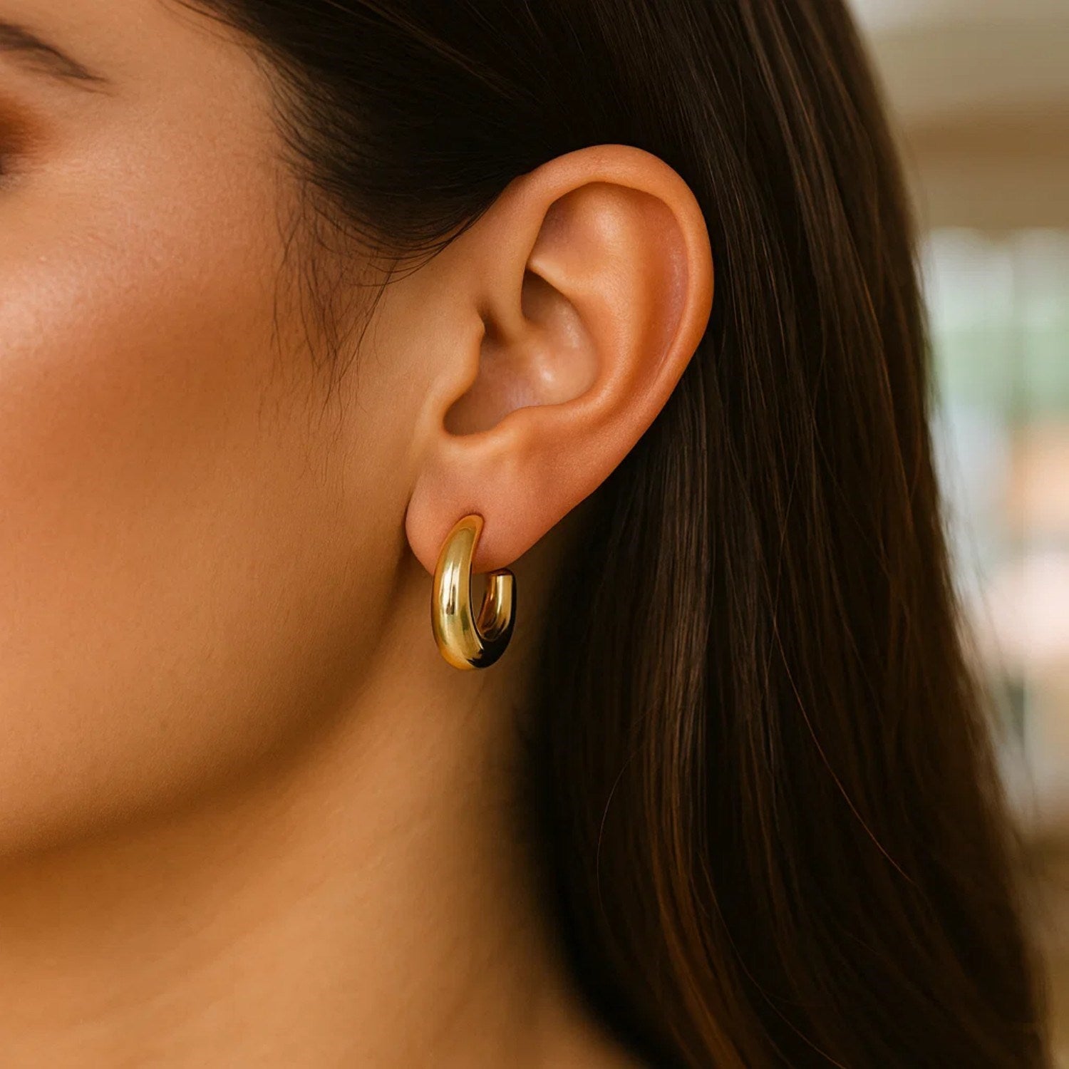 14k yellow gold polished hoop earrings with a sleek modern design, perfect for elegant everyday wear.