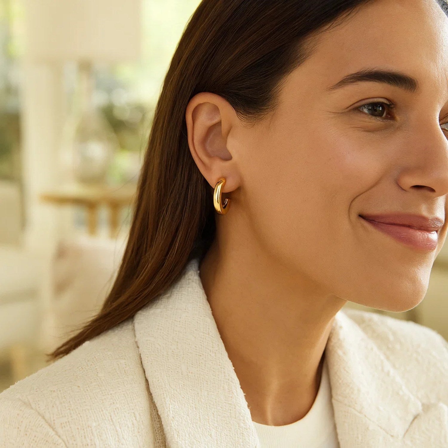 14k yellow gold polished hoop earrings with a sleek modern design, perfect for elegant everyday wear.