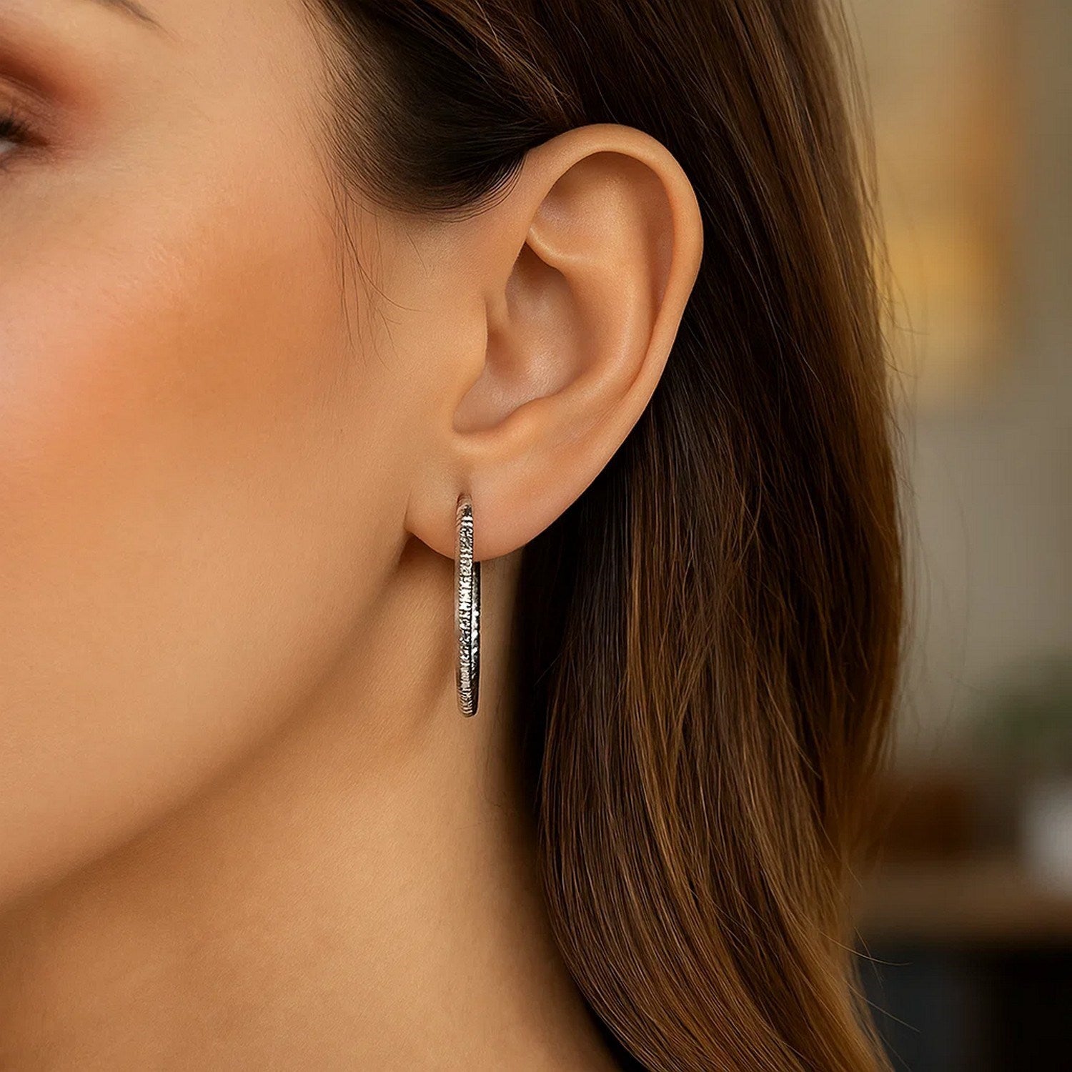 Sterling silver rhodium plated polished hoop earrings with a sleek modern design, perfect for elegant occasions.