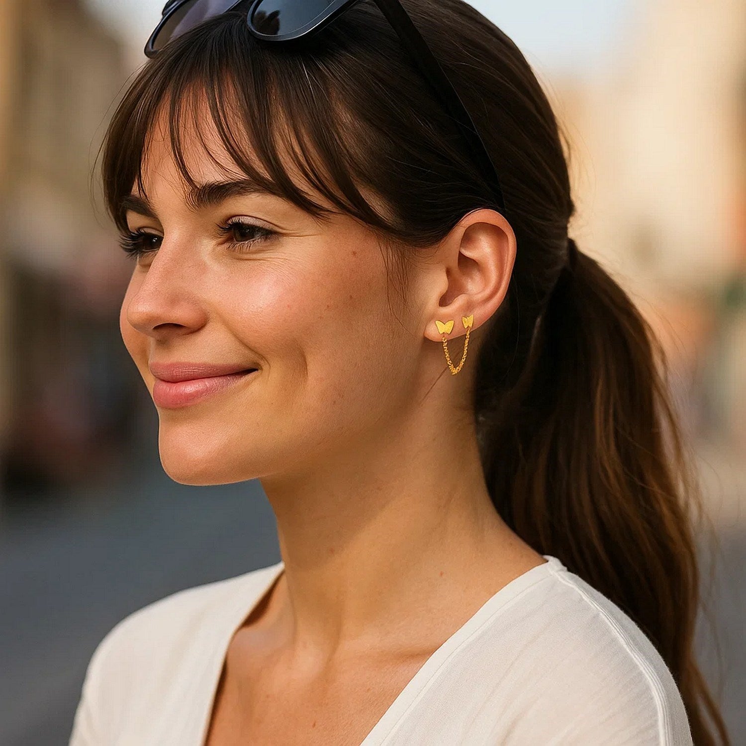 14k yellow gold modern butterfly earrings featuring two hole post design for a luxurious touch.