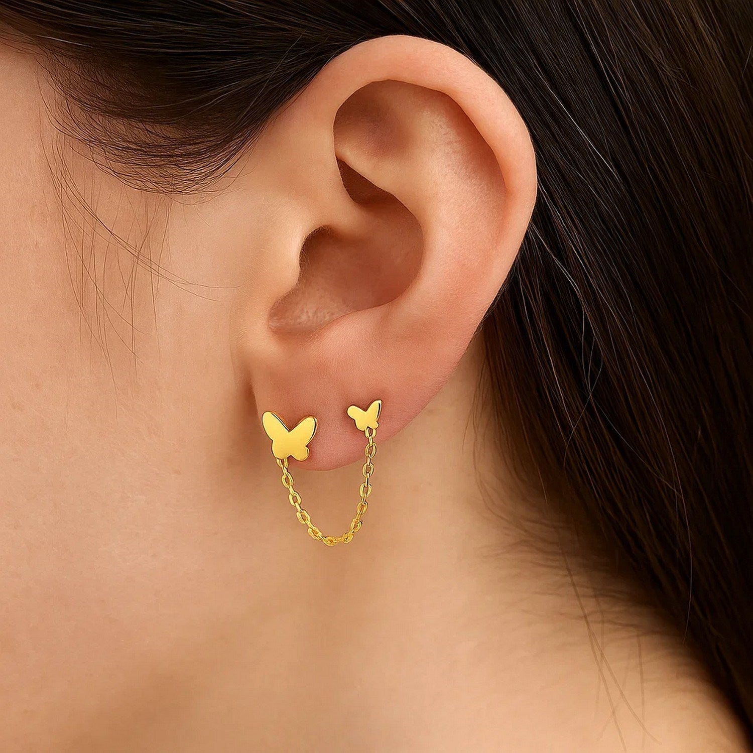 14k yellow gold modern butterfly earrings with two hole post design, exuding luxury and elegance.