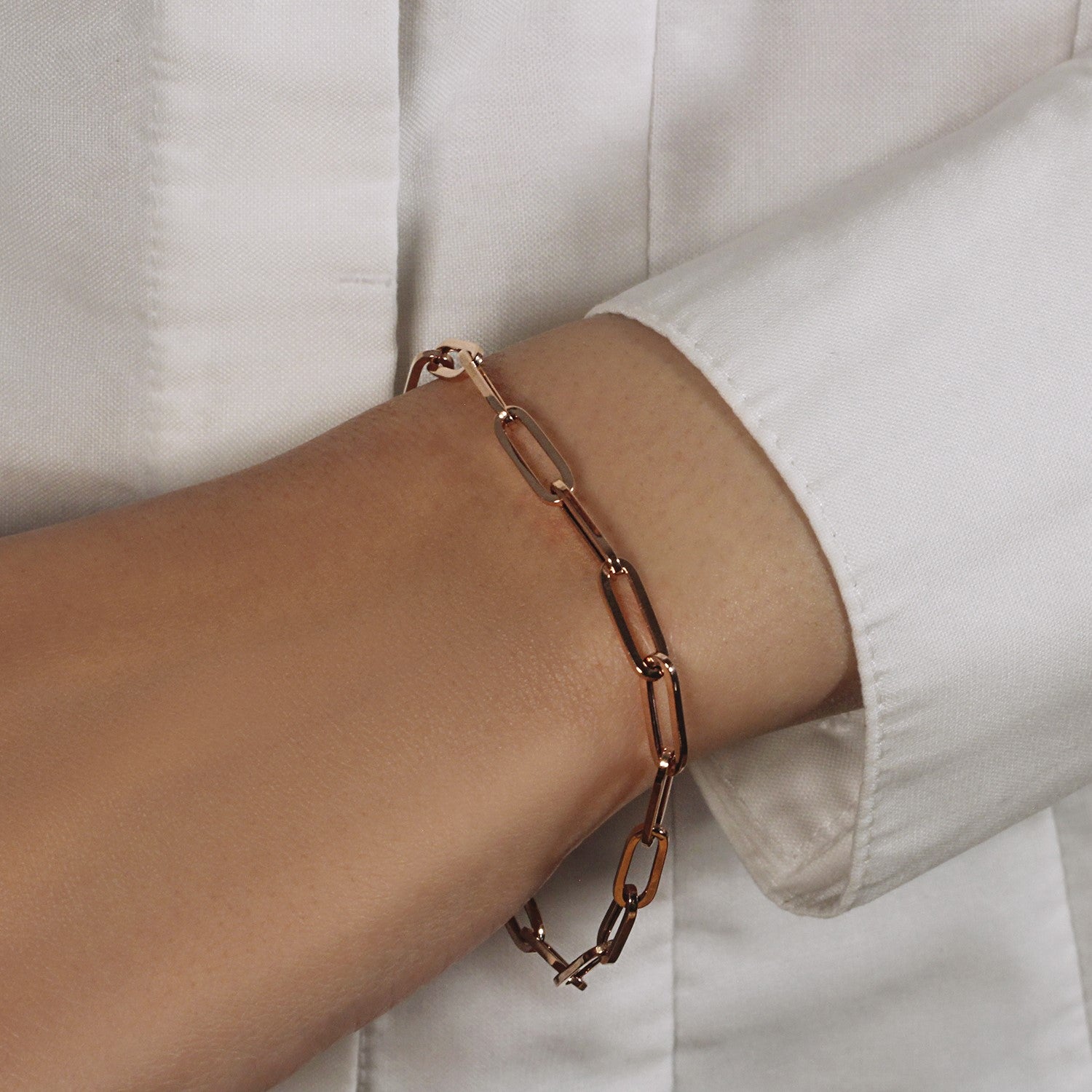 14k rose gold bold paperclip chain bracelet featuring modern links, perfect for elegant layering or standalone wear.